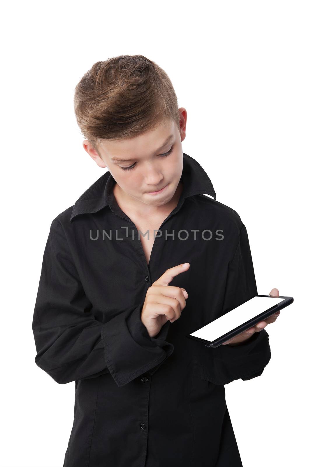 Charming boy using tablet isolated on white background. Modern lifestyle.