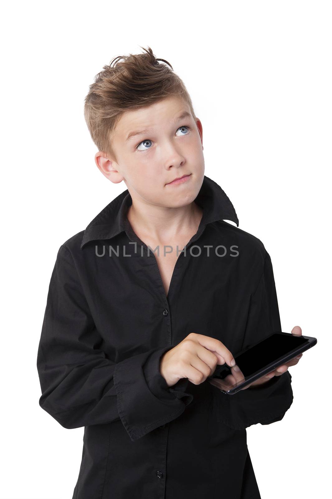 Casual boy with black dress shirt using tablet and thinking isolated on white background. Contemporary modern lifestyle.
