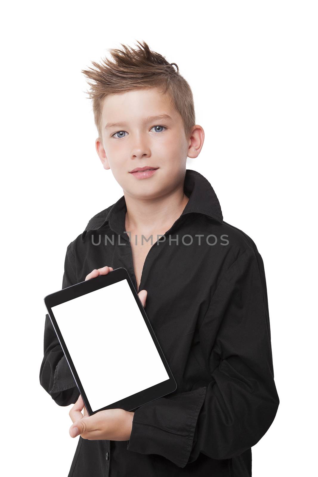 Charming young boy holding tablet with blank screen isolated on white background. Generation Z.