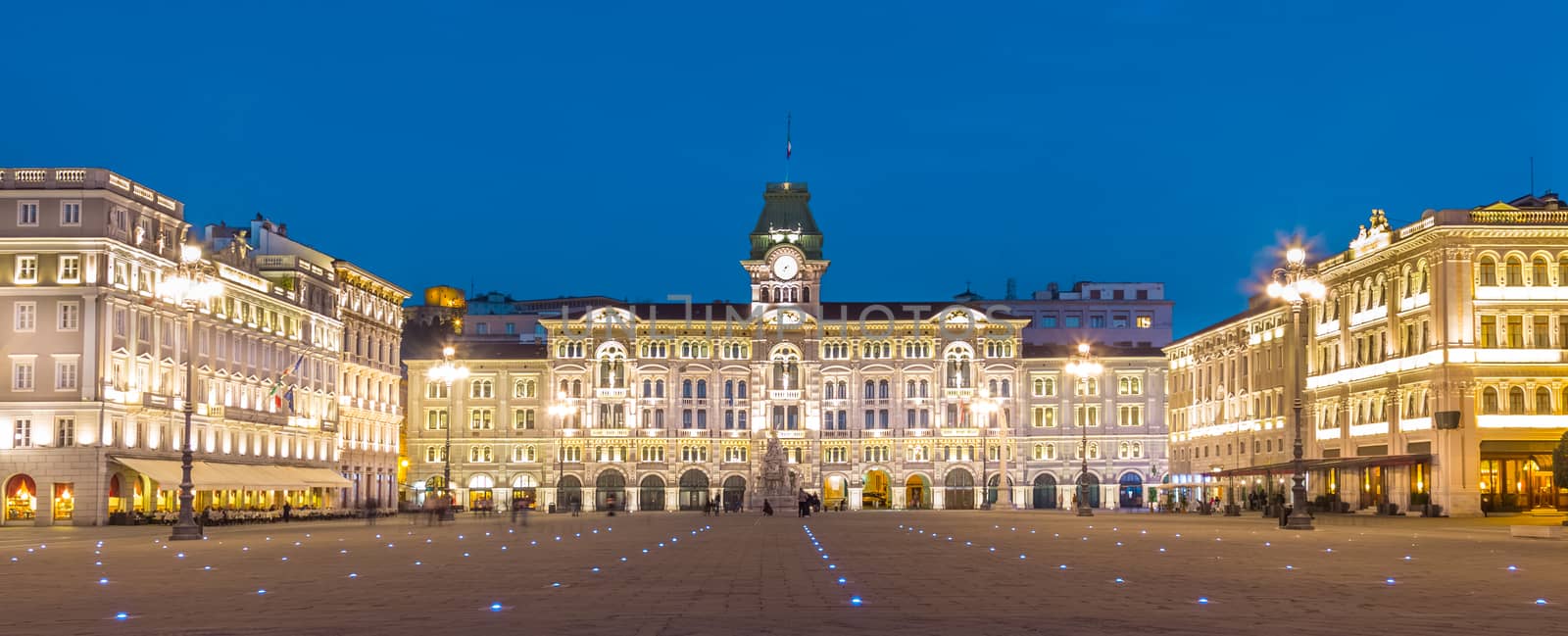 The City Hall, Palazzo del Municipio, is the dominating building on Trieste's main square Piazza dell Unita d Italia. Trieste, Italy, Europe. Illuminated city square shot at dusk.