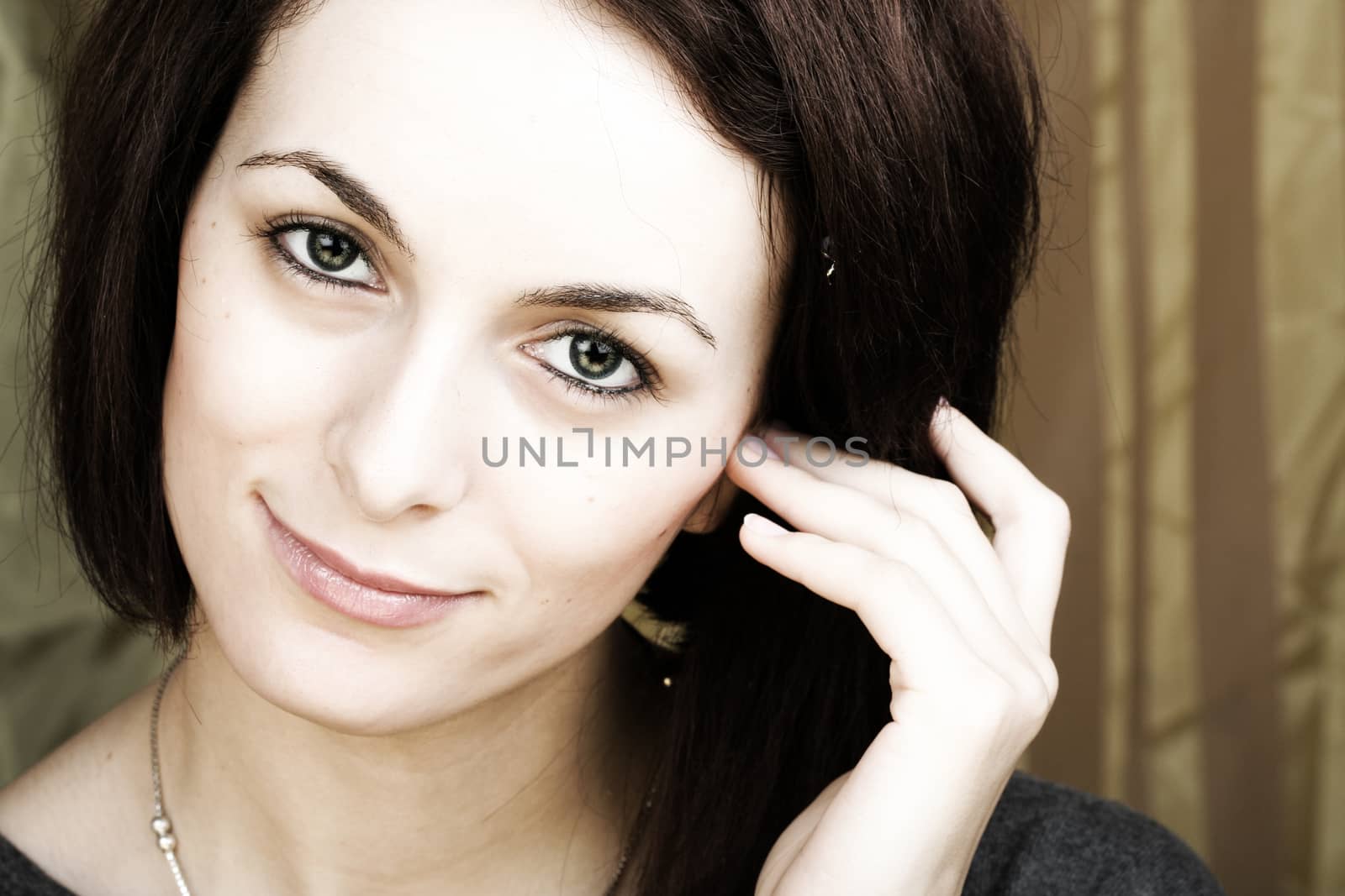 Beautiful happy woman with green eyes.