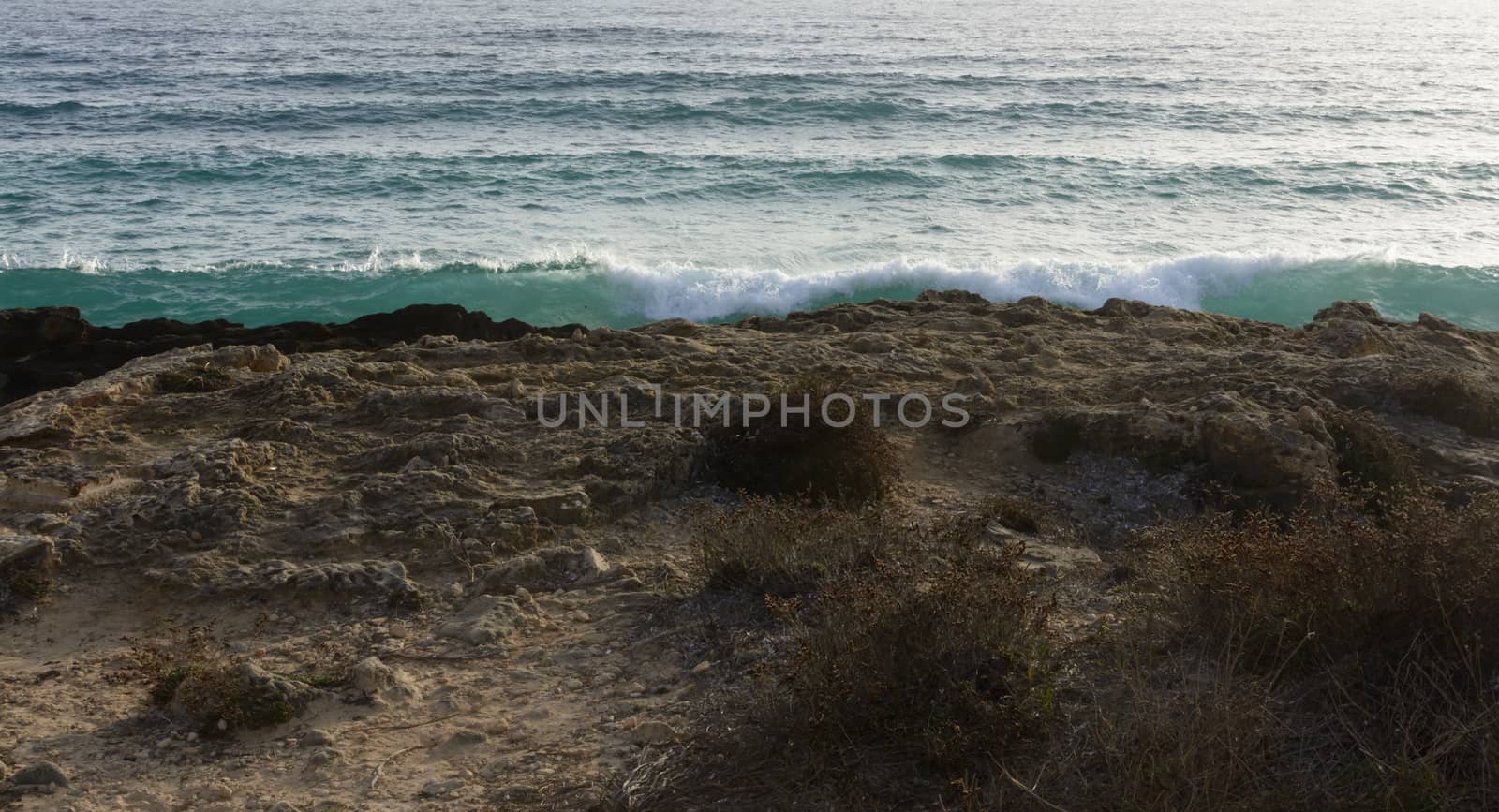 Breaking waves in Ses Covetes, Majorca.