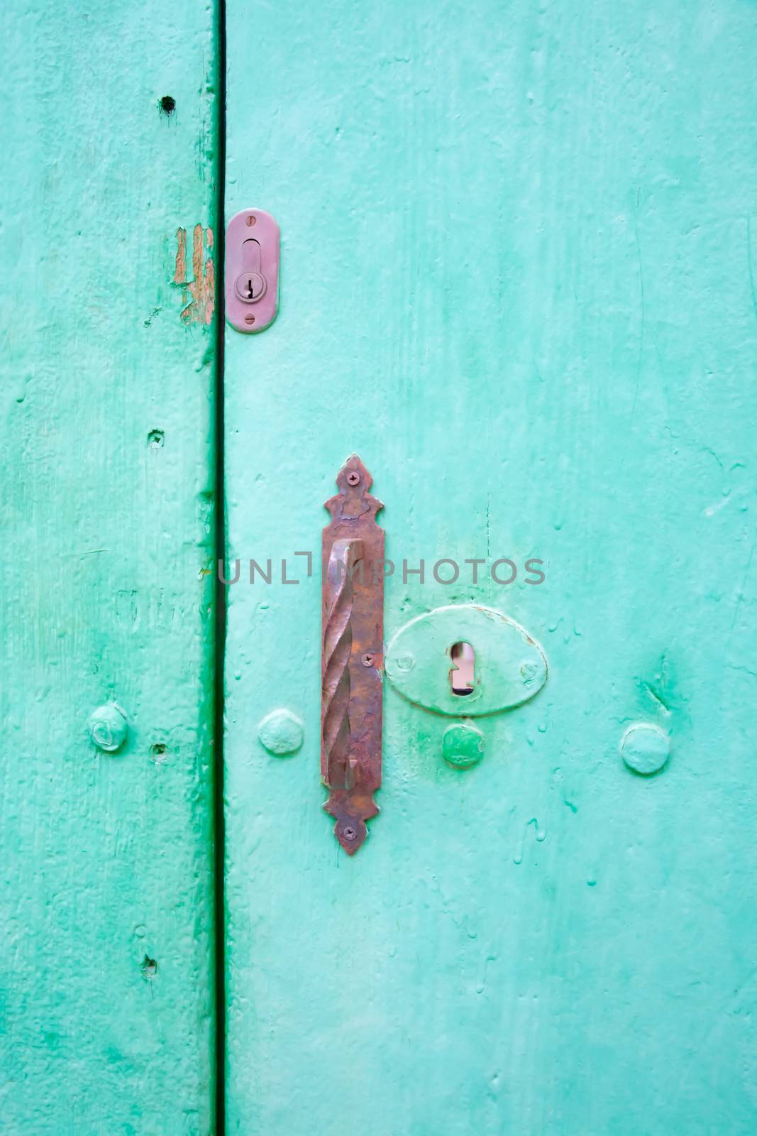 Green door with old locks by ArtesiaWells