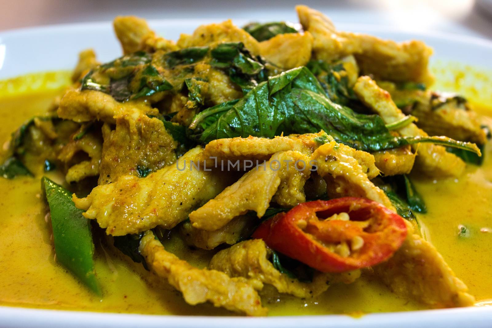 Stir fried pork and curry paste win dish