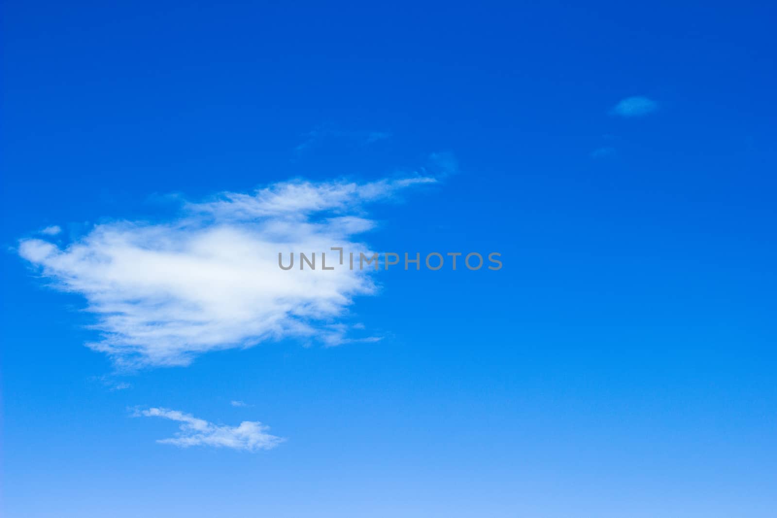 blue sky with cloud closeup by kannapon