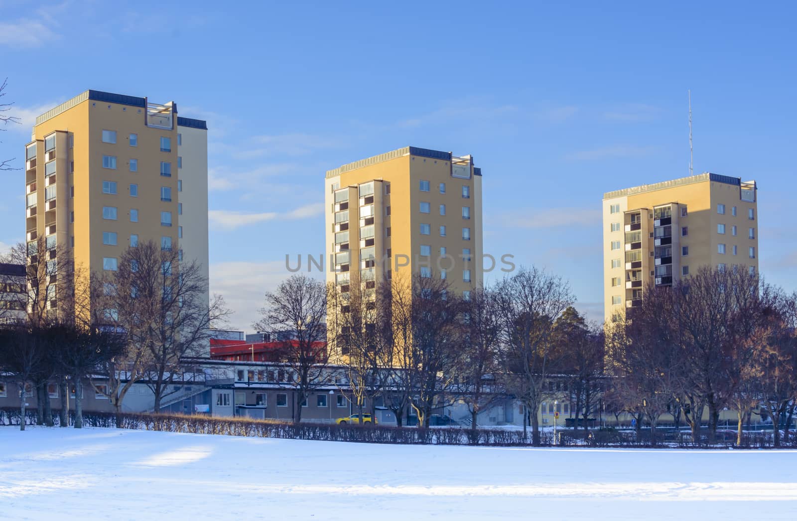 Three high rise buildings in Vallingby, Stockholm, Sweden on a sunny winter day.