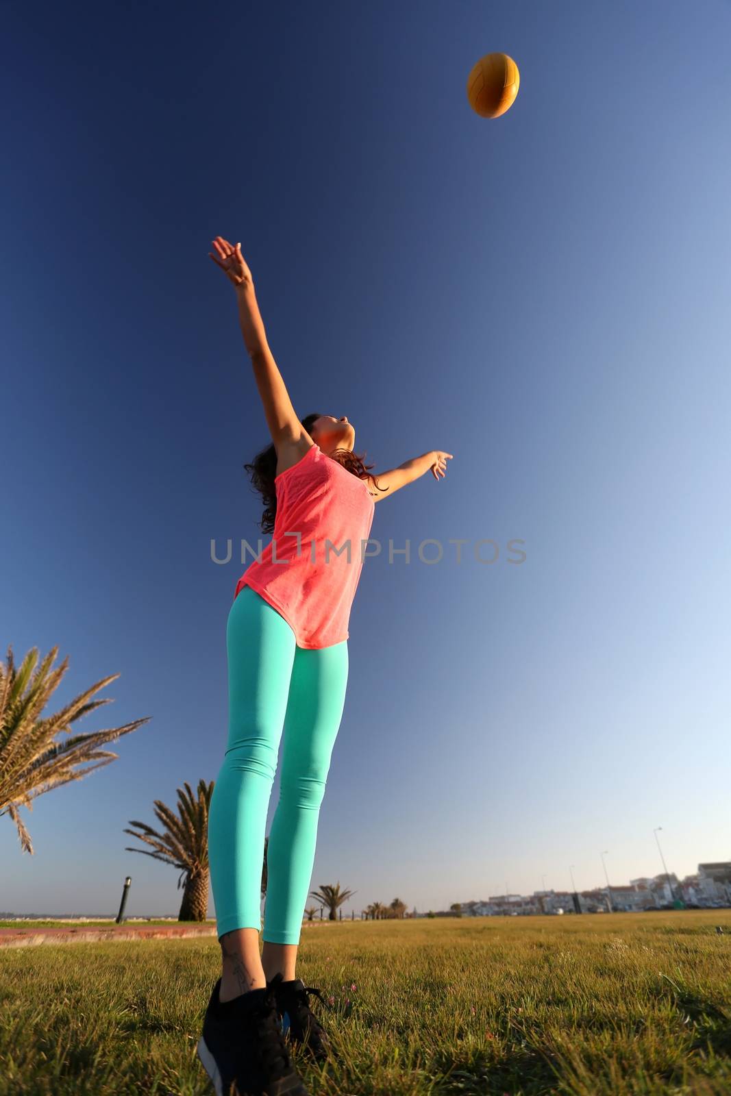 Woman playing with a ball by jolopes