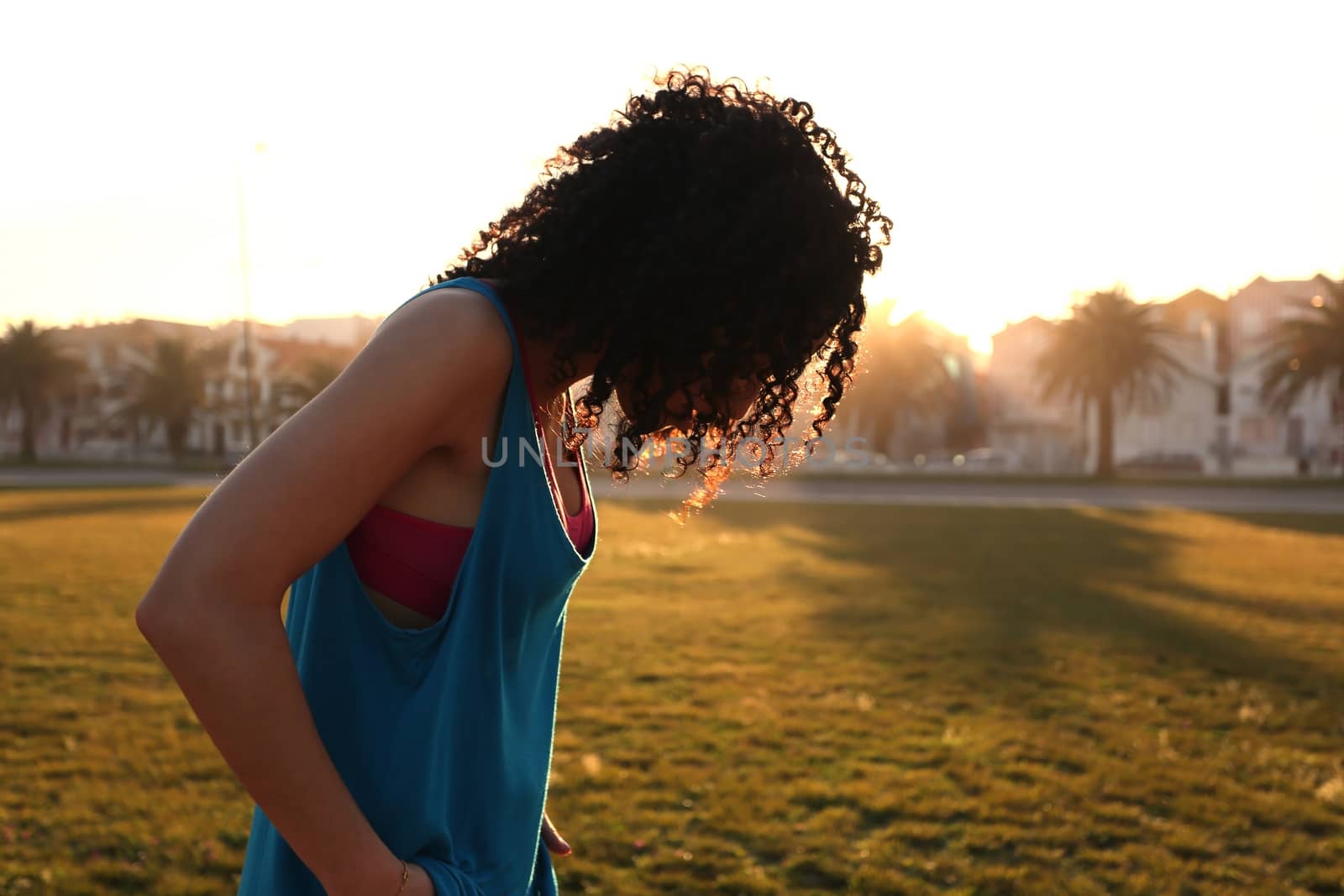 Woman walking in the city park by jolopes