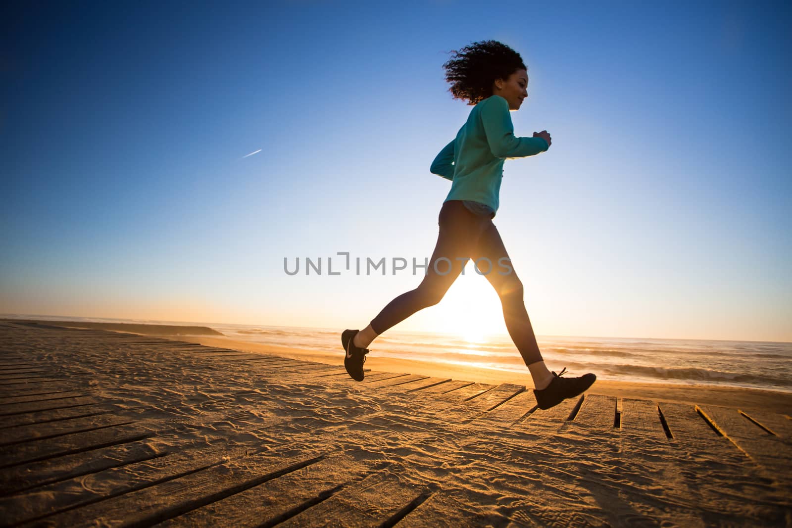 Afro woman running by jolopes
