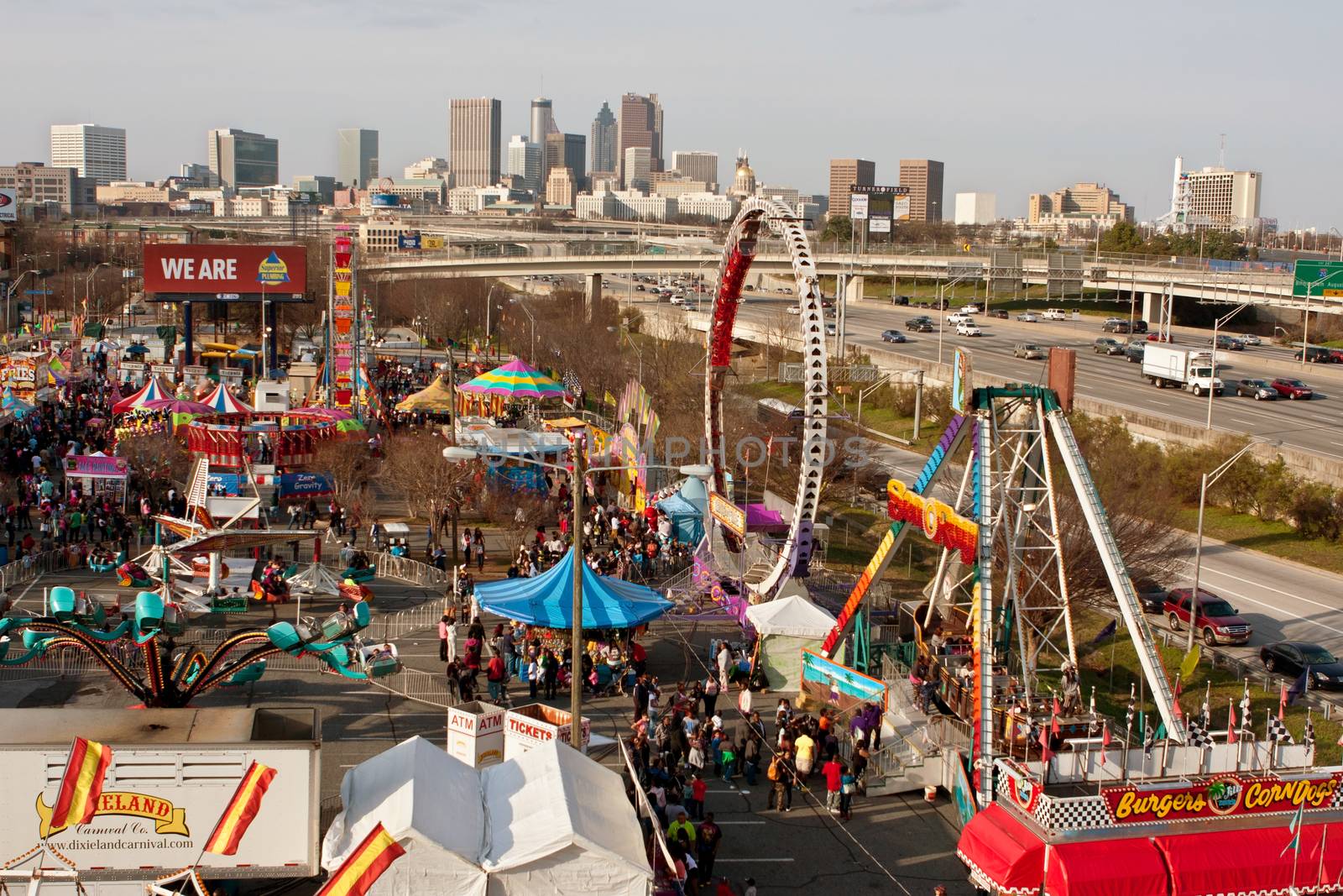 Atlanta, GA, USA - March 15, 2014:  Elevated wide shot of annual Atlanta Fair, with city skyline in background. 
