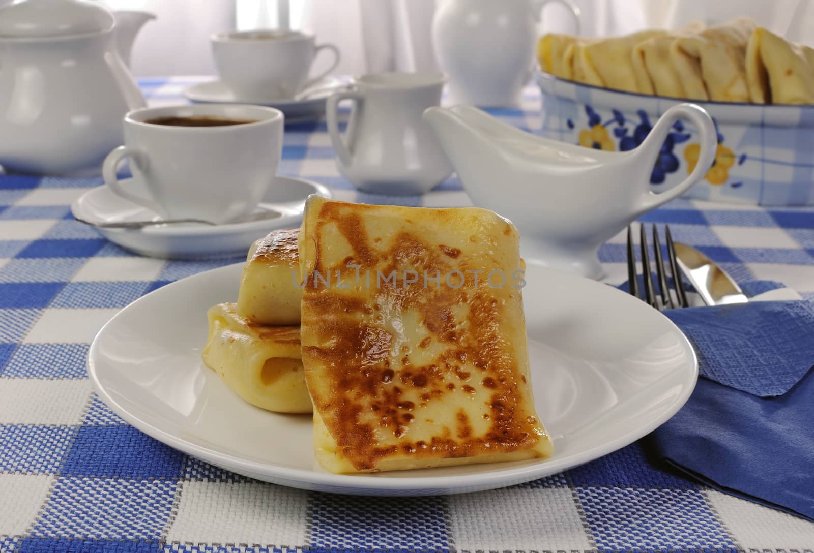 Spring rolls and a cup of coffee on the table