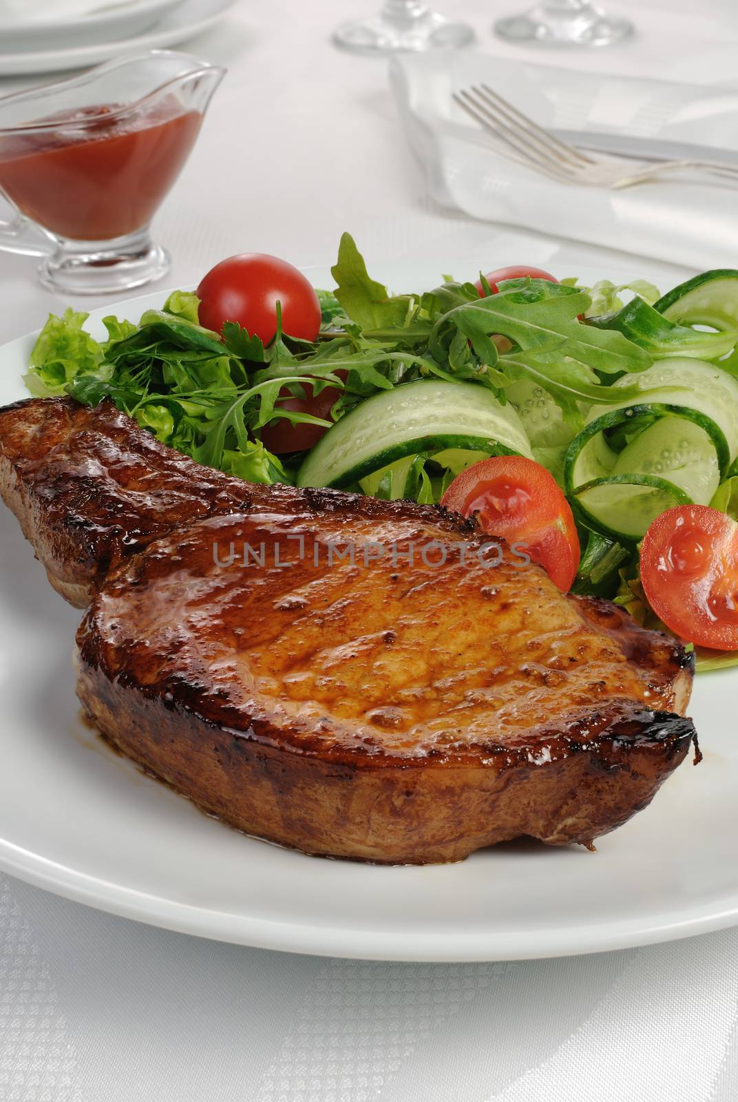 Grilled steak with vegetables on bone by Apolonia