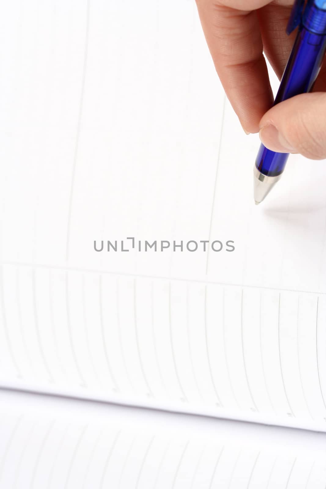 Close-up of woman hand writing in agenda