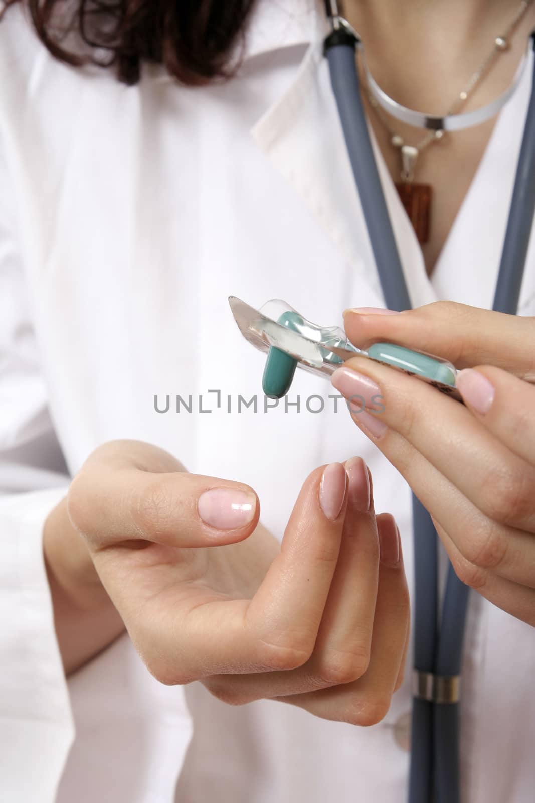 Doctor with drugs in her hands.