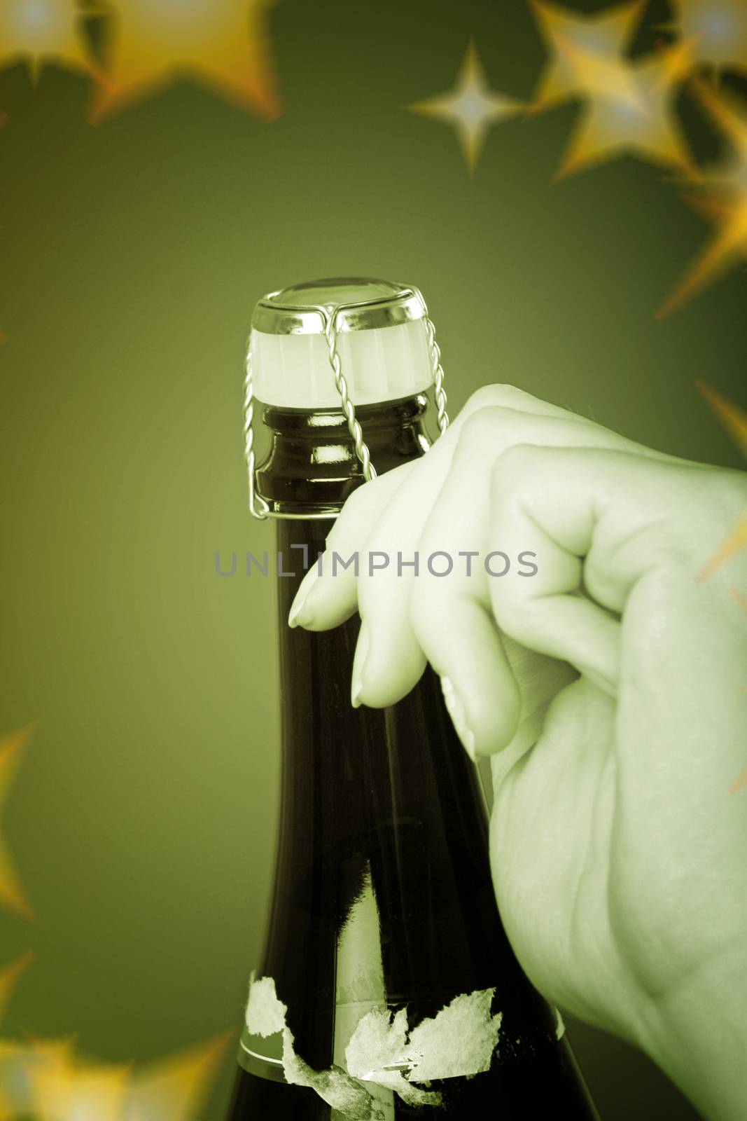 Woman hands opening champagne bottle