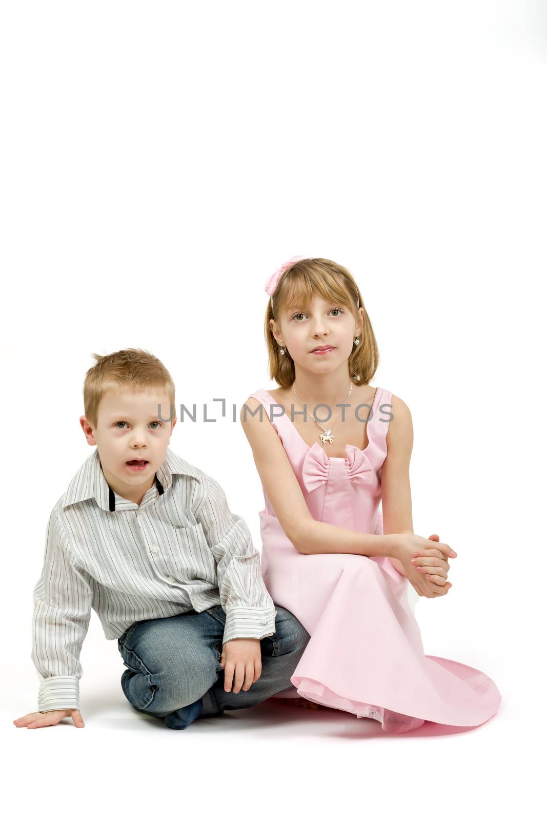 Studio portrait of siblings beautiful boy and girl by artush