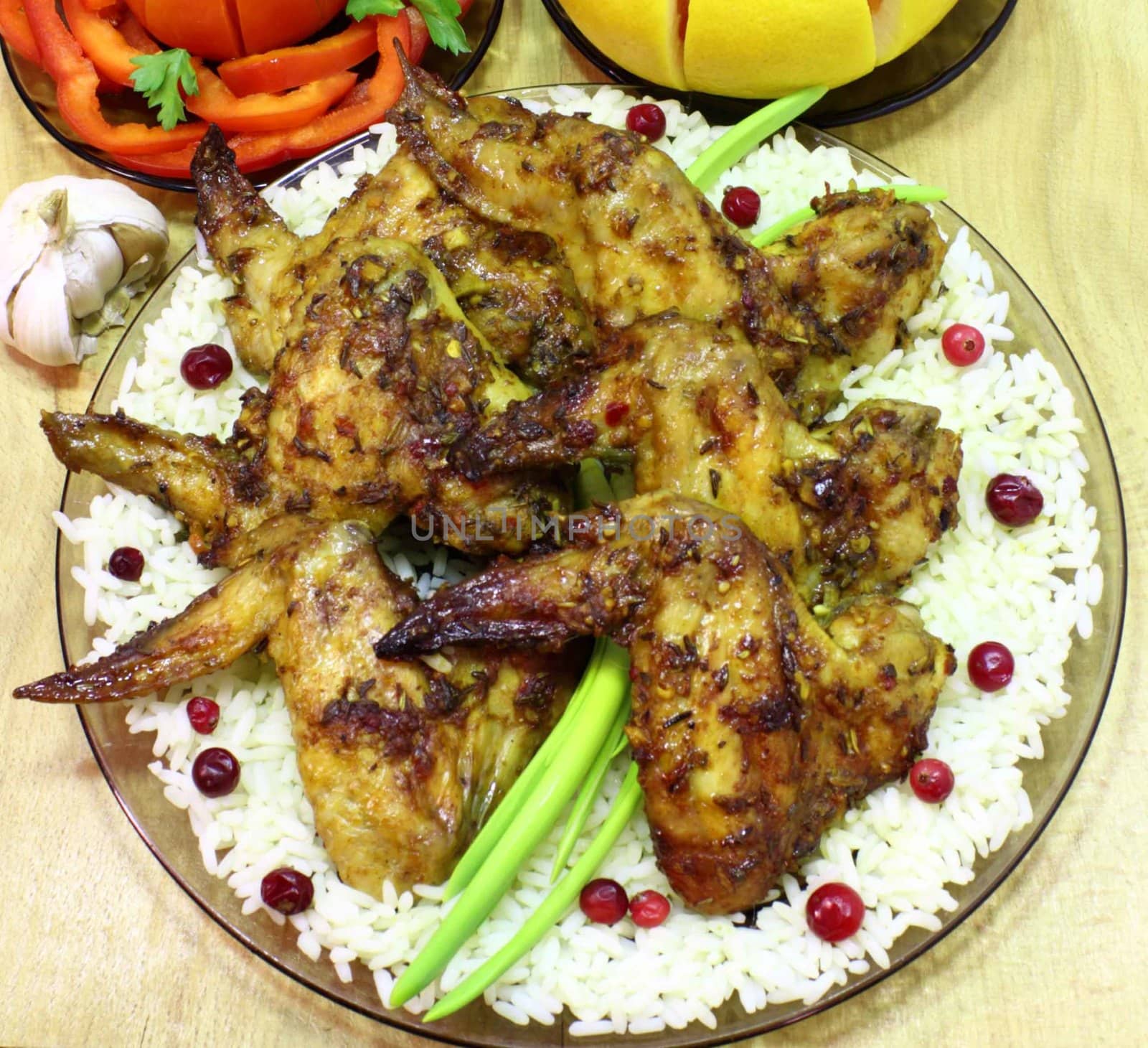 fried chicken wings with rice and cranberries