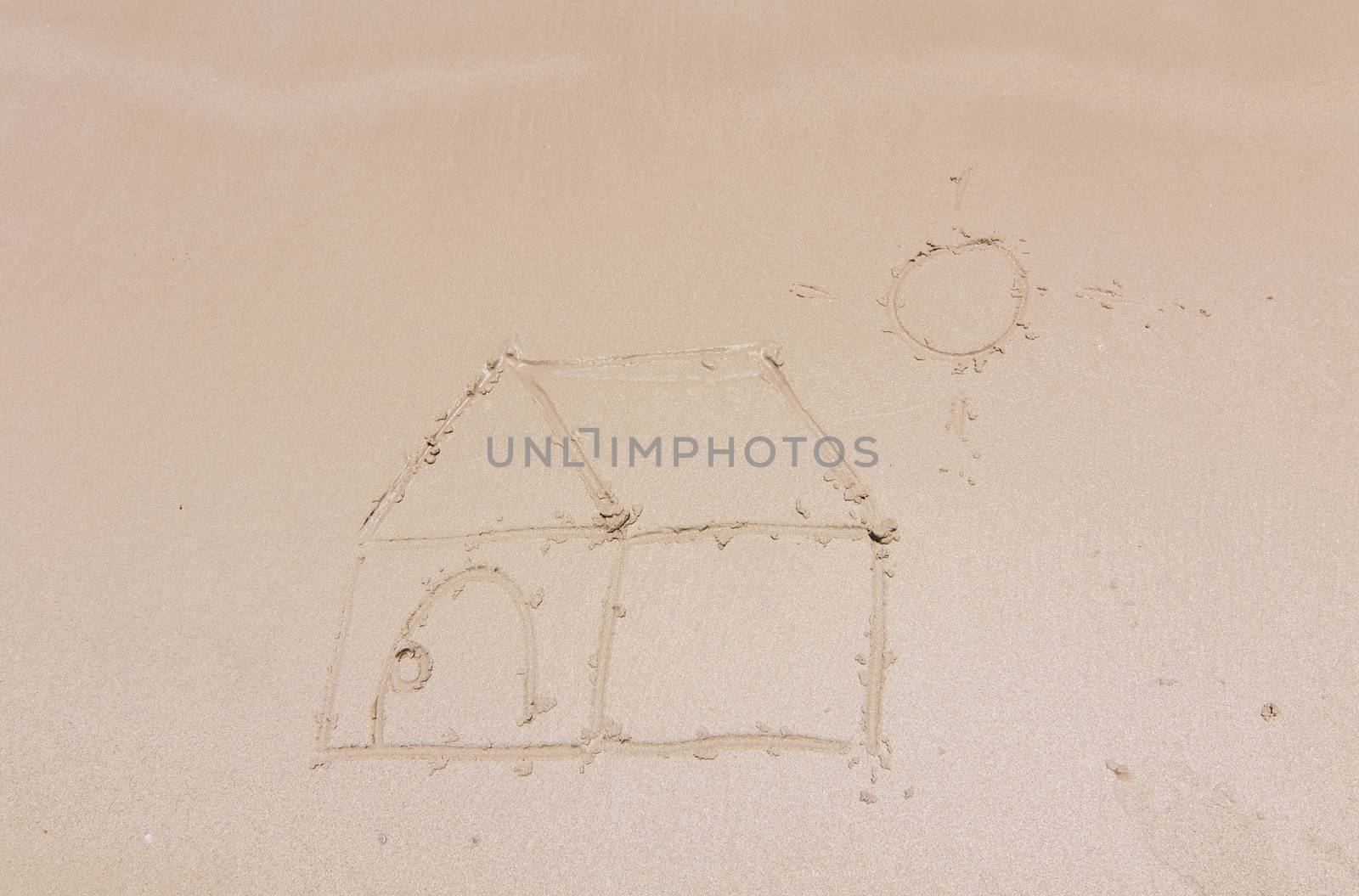 Painting a house on sand background with the sun