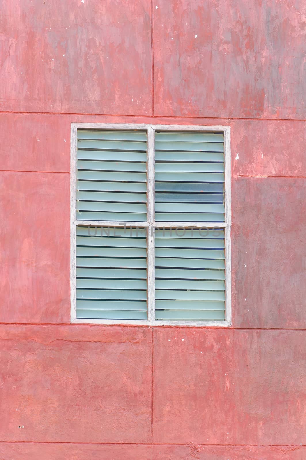 Grunge window were painted red color.