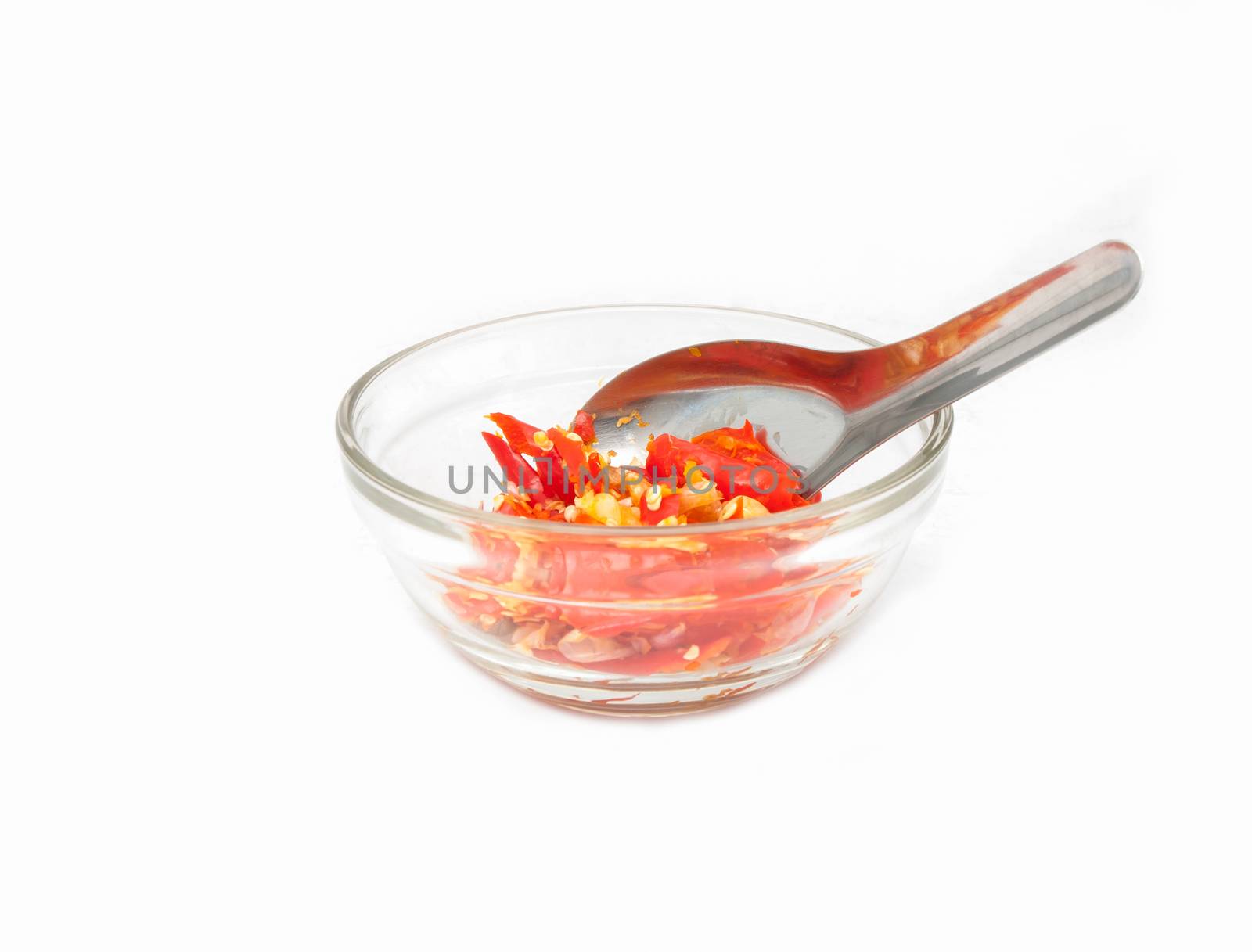 Crush chilli in the cup on white background