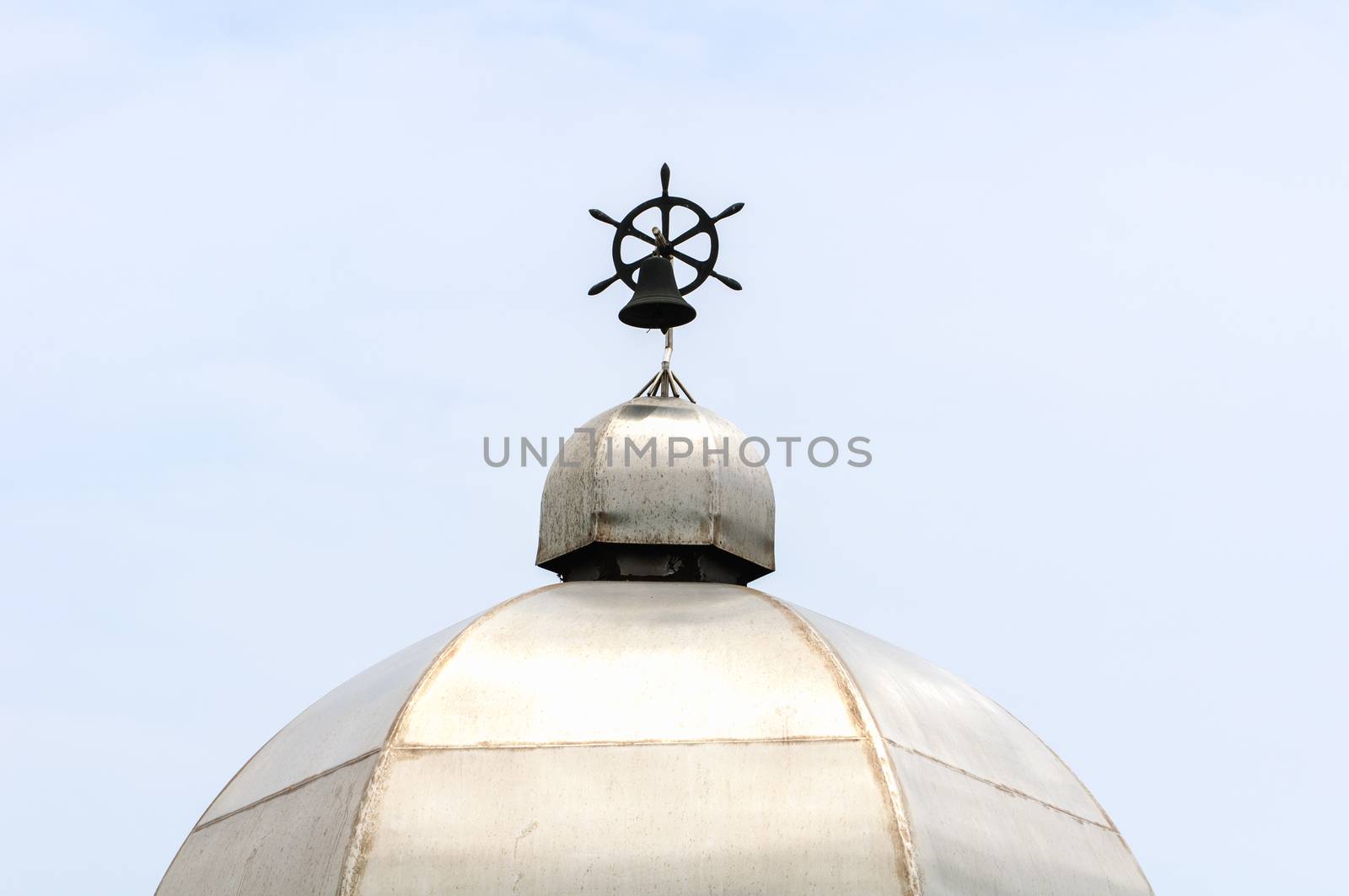 Black bell on the roof is high.