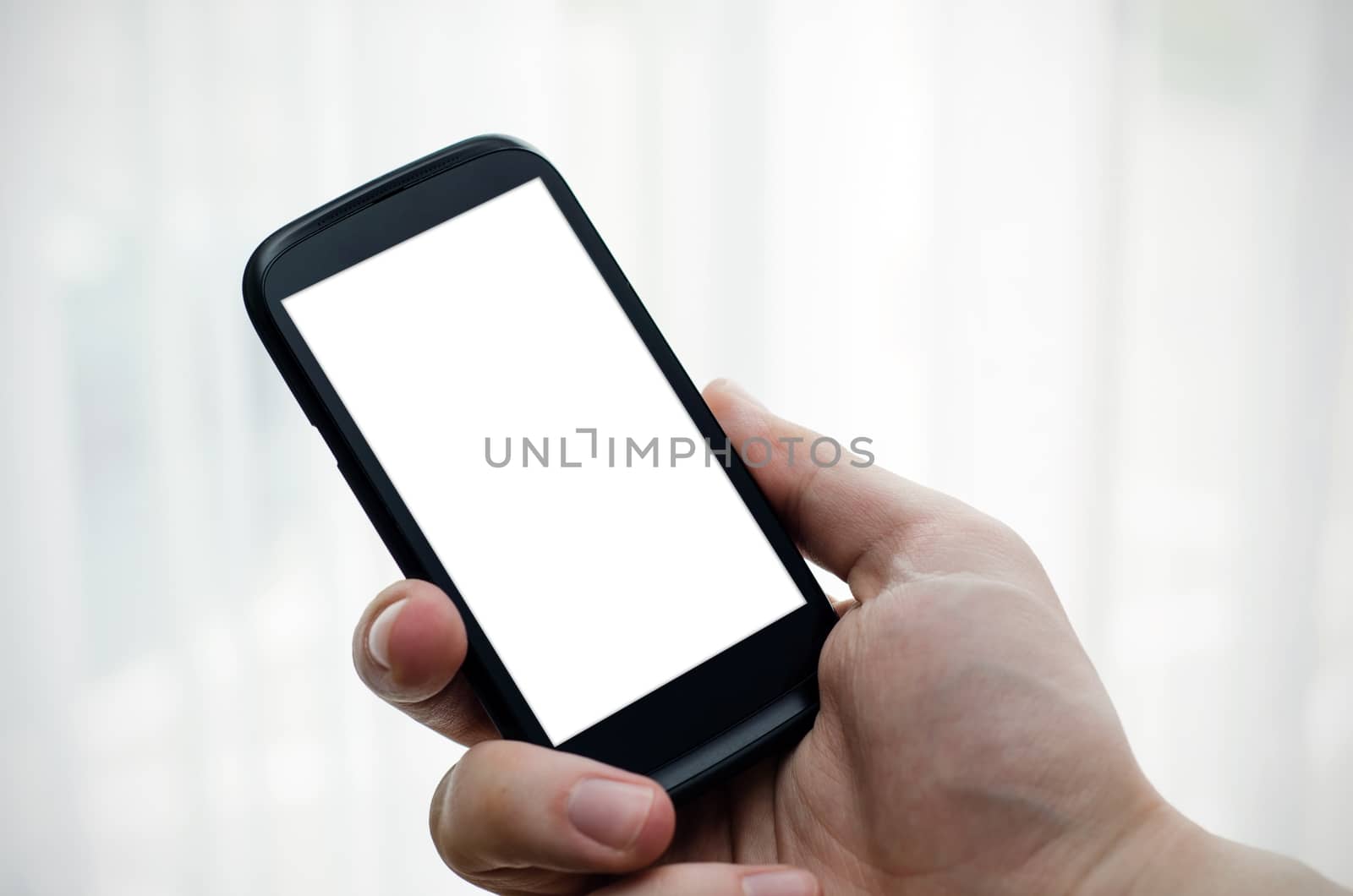 Hand holding mobile phone with blank display by simpson33