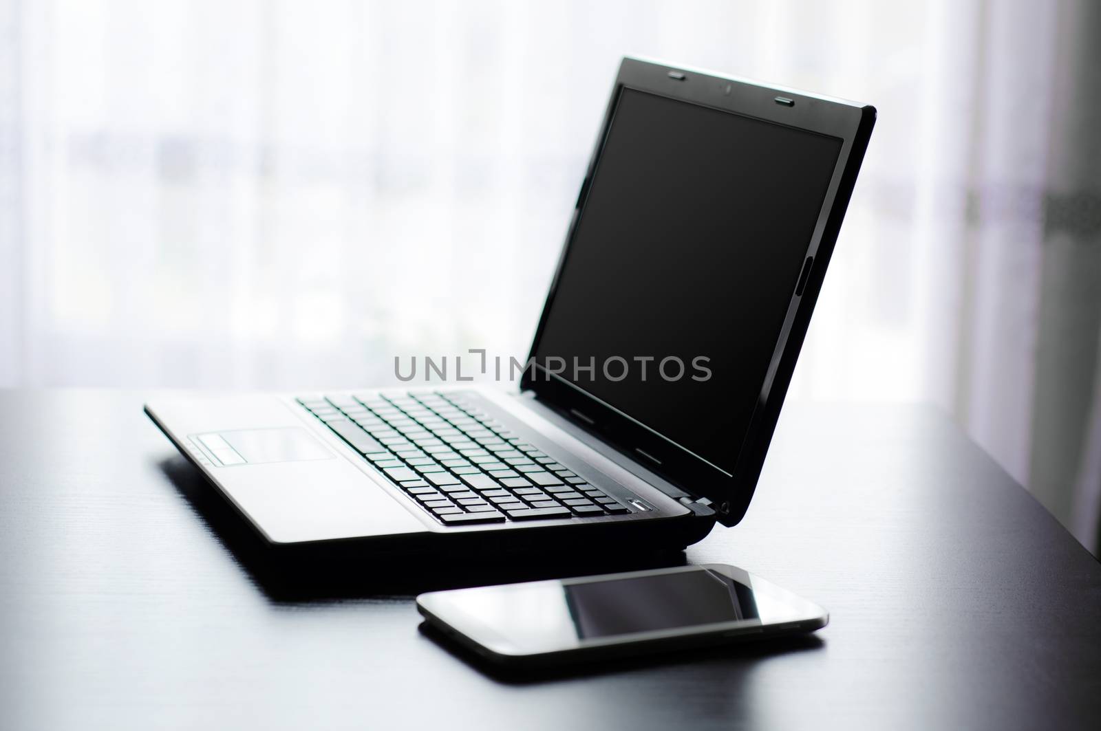 Modern laptop and tablet in office by simpson33