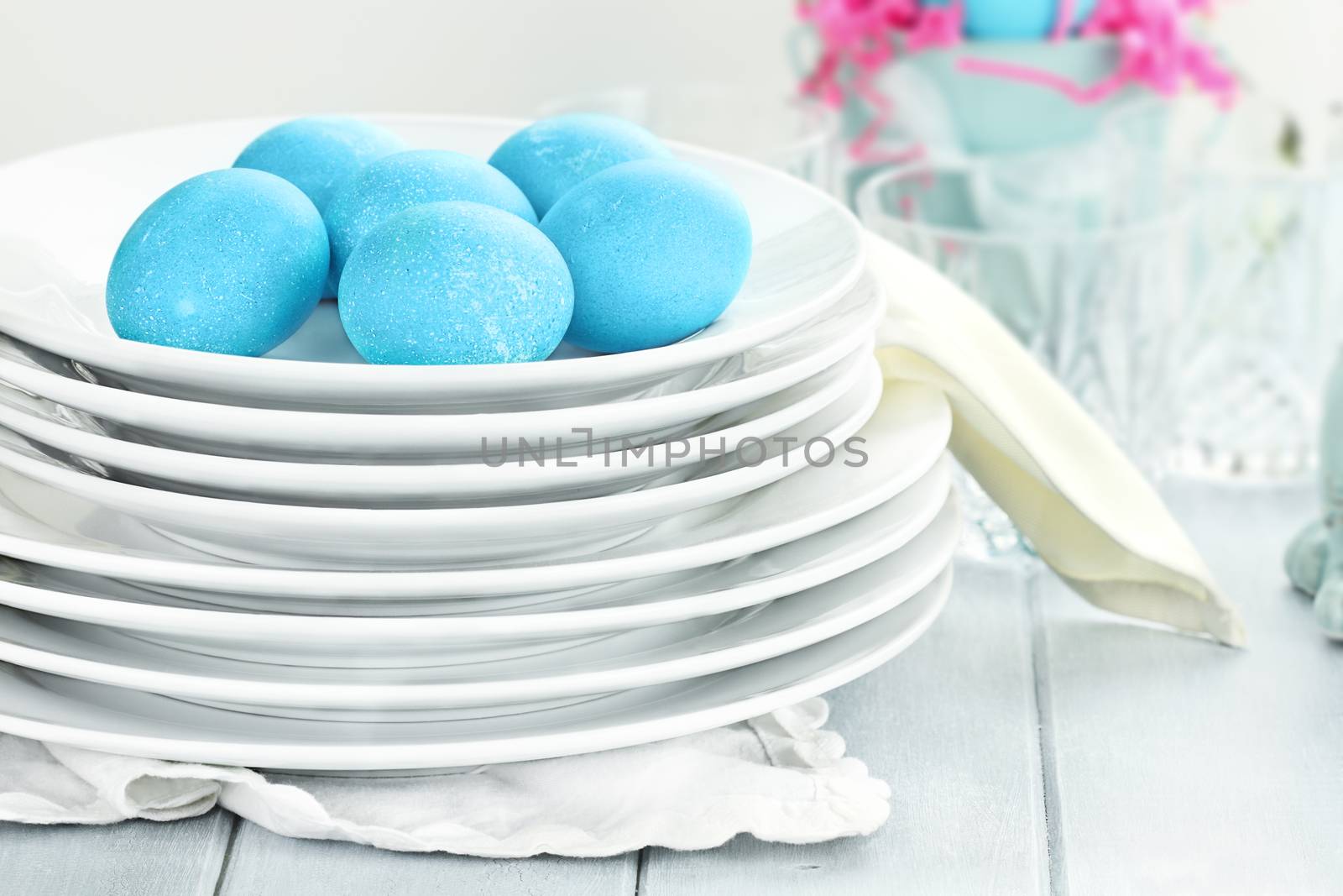 Blue dyed eggs with plates for Easte. Shallow depth of field.