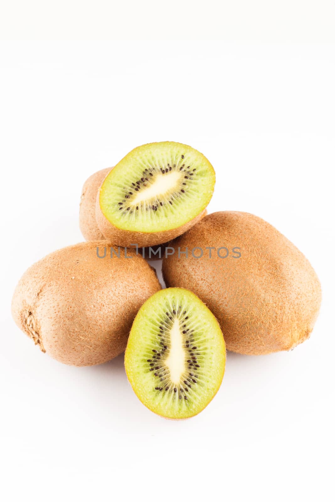 kiwi fruits whole and sliced on white background