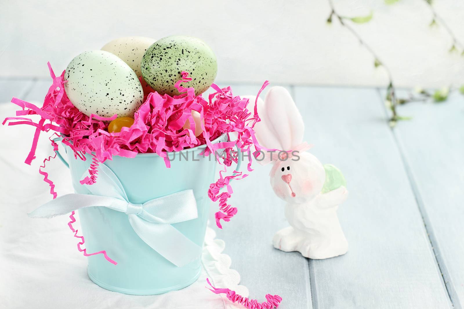 Easter eggs in a blue tin bucket. Shallow depth of field.