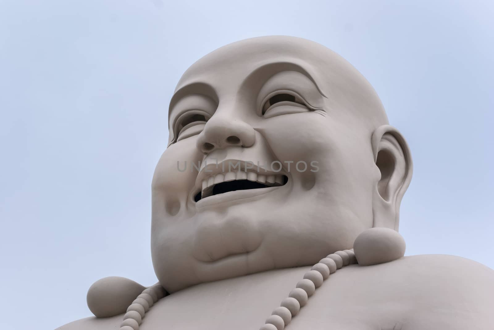 At the Vinh Tranh Pagoda in My Tho, the Mekong Delta, stands this huge statue of the smiling Buddha. Here, the head is isolated and fills the entire picture.