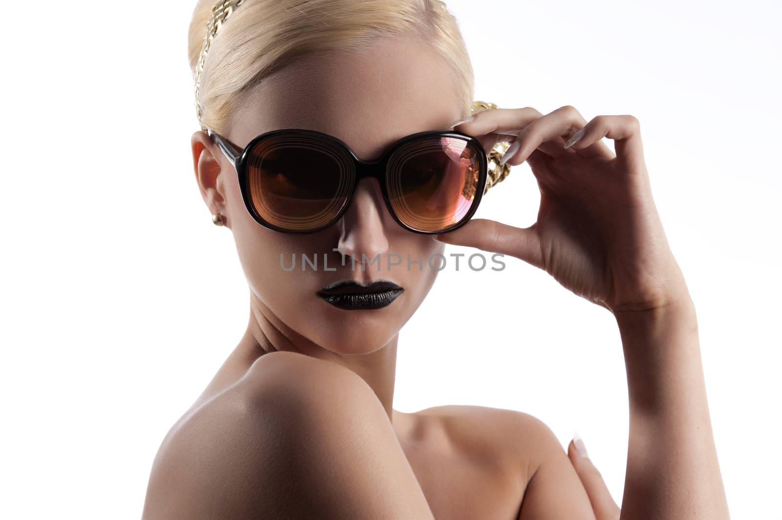 fashion portrait of young blond woman with hair style black lips and wearing gold sunglasses over white
