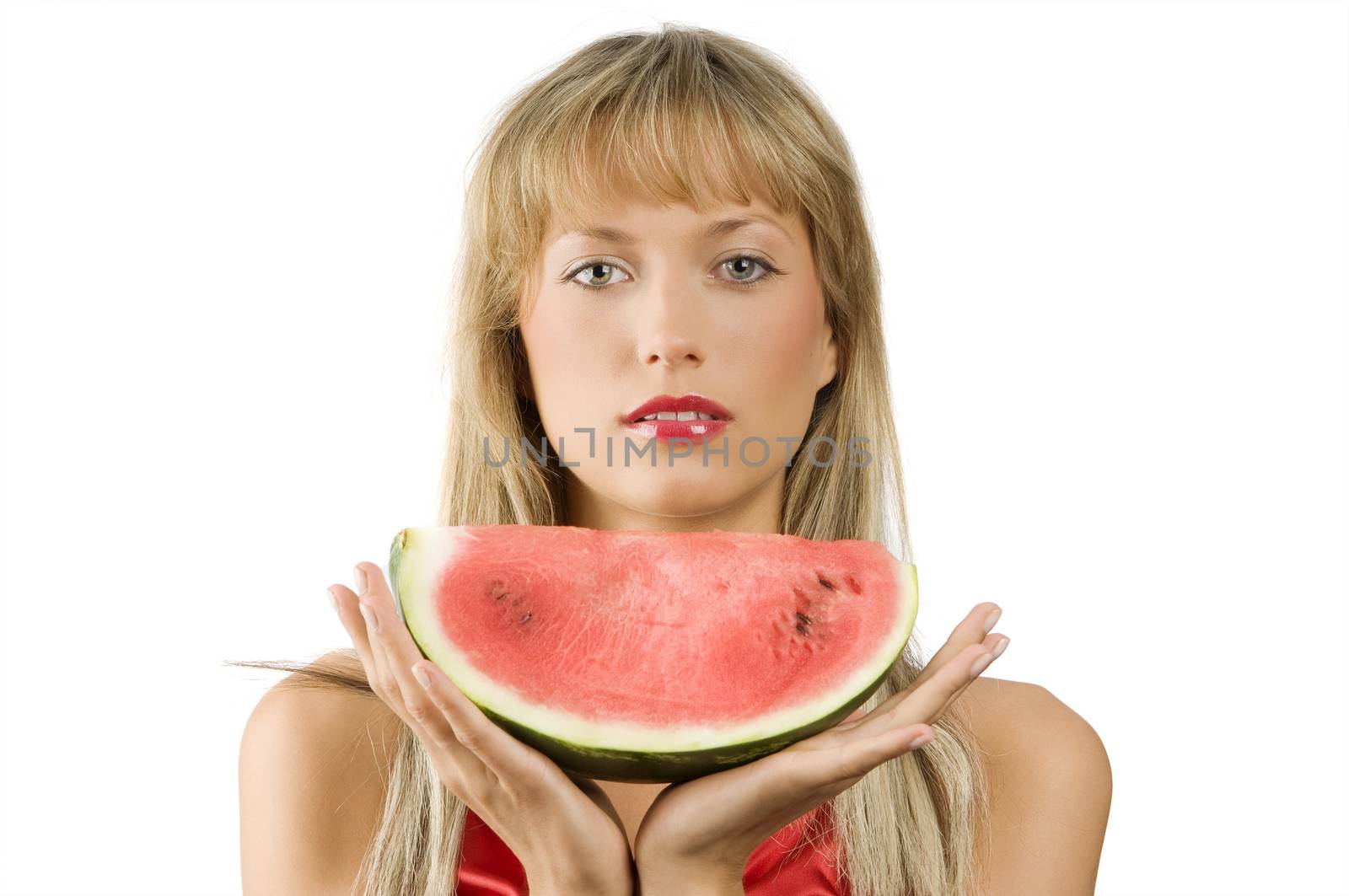 cute blond girl in red dress and red lips with a piece of water melon in hands
