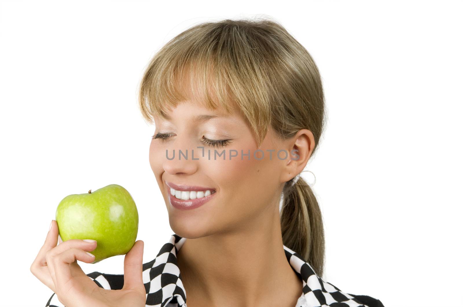 cute blond girl with a green apple on one hand smiling