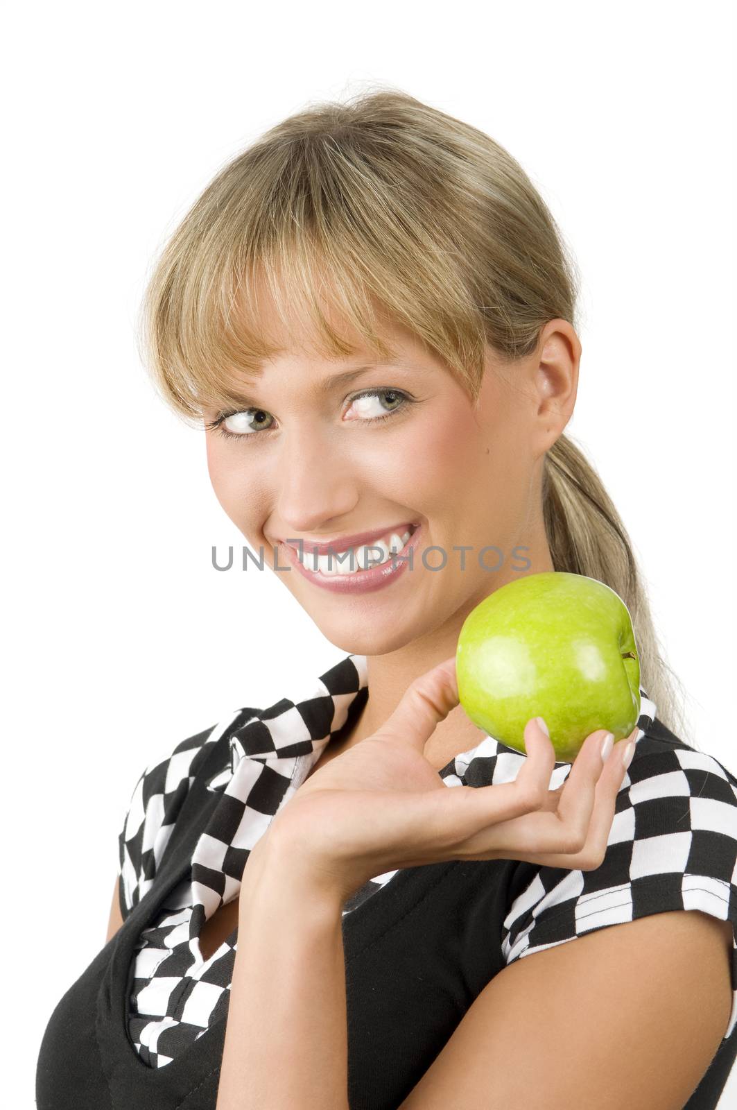 pretty blond woman with a green apple biting one lip of her mouth