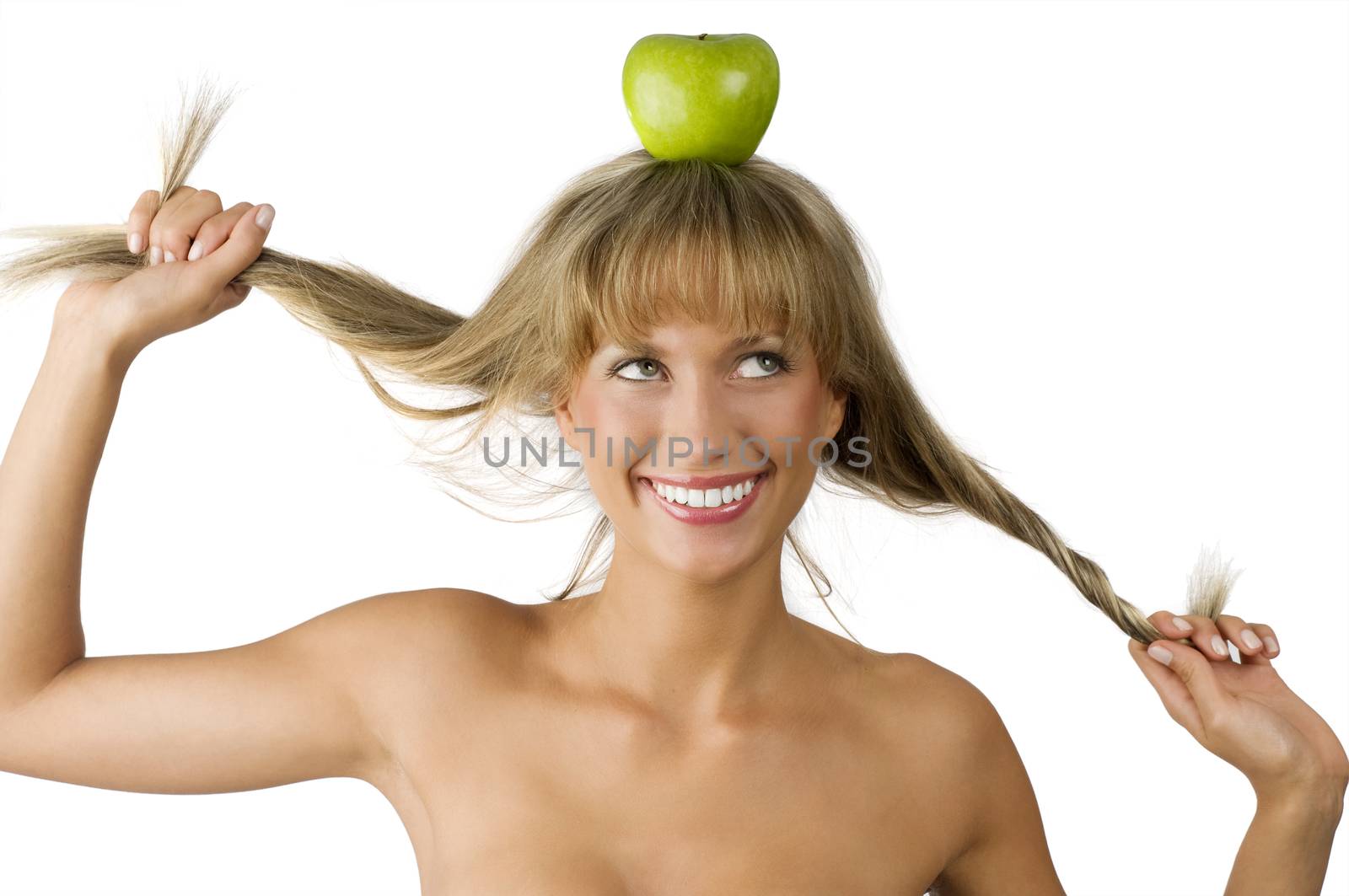 nice pretty woman with a green apple on her head smiling and pulling hair