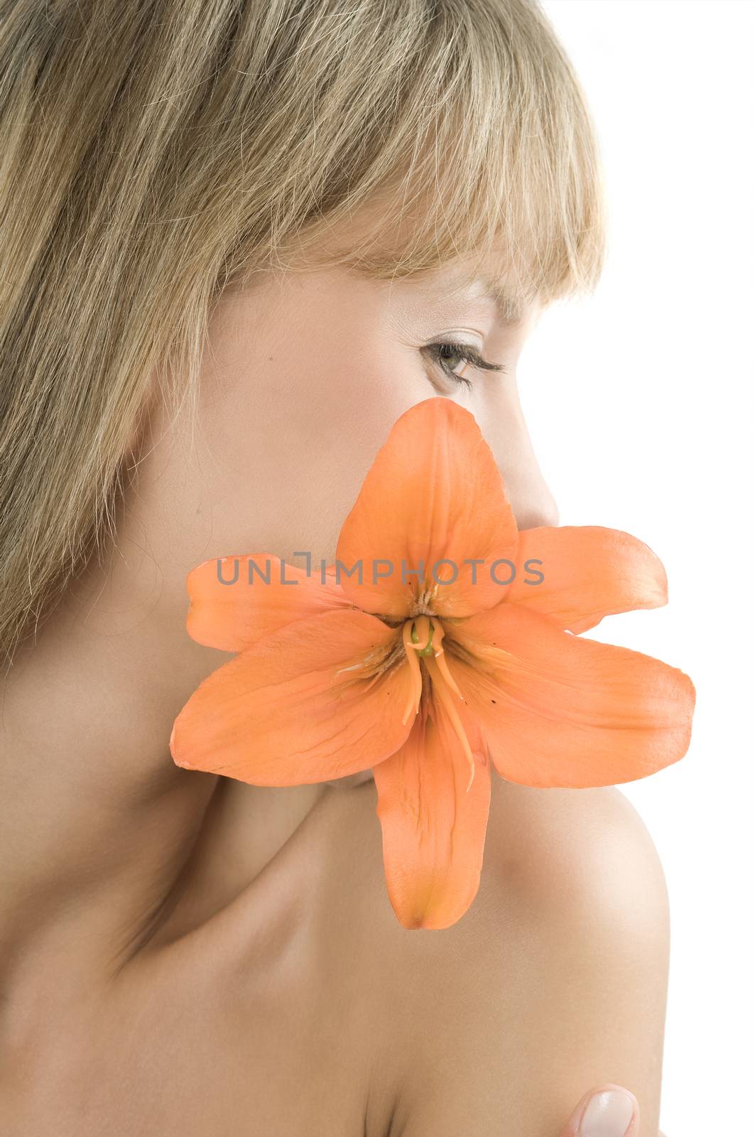 fresh and beautiful portrait of a woman with an orange lily