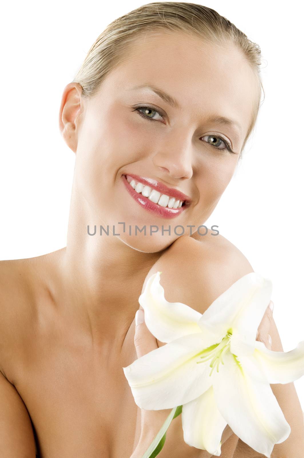 great smile froma blond pretty girl with fair eyes and a big flower