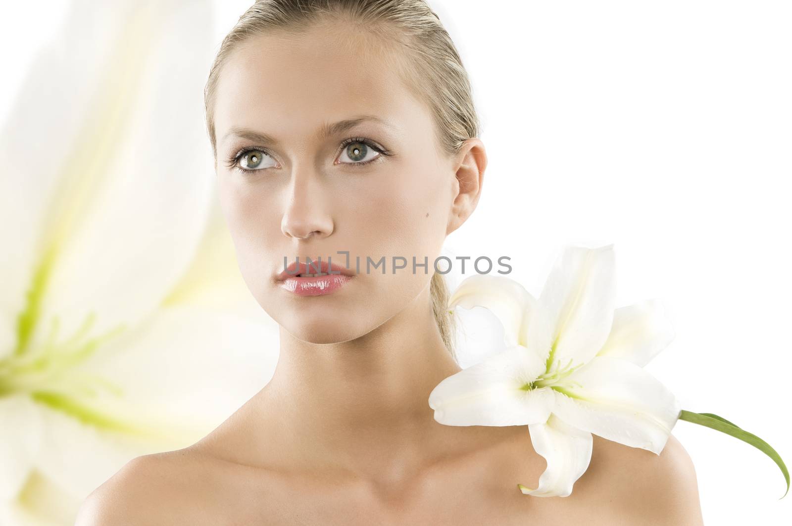 fresh portrait of a young and beautiful woman with a white lily