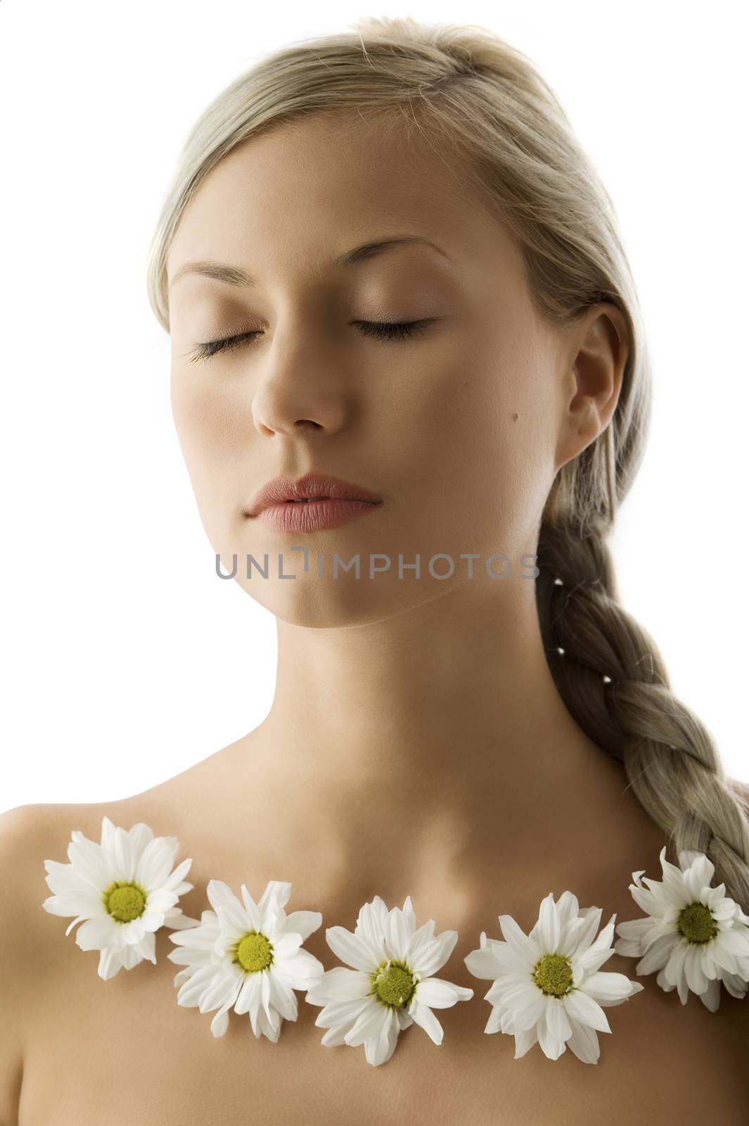 closed eyes portrait of a beautiful woman with twist braid and a flowers necklace