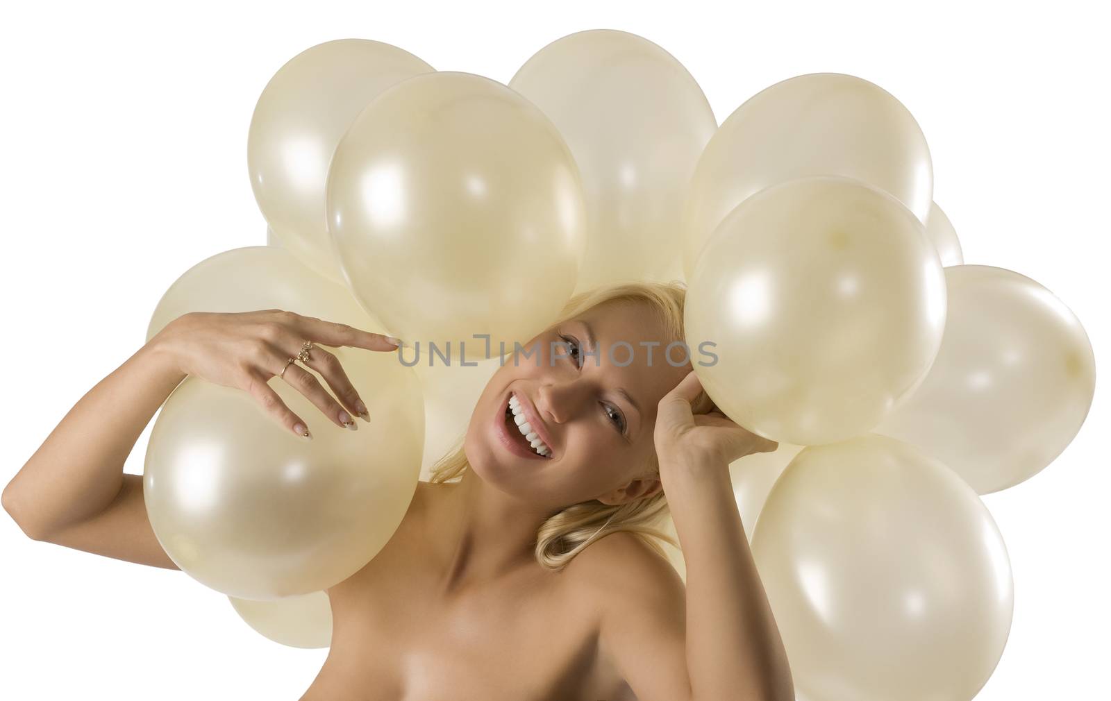 pretty blond girl playing with air ballons over her head looking and smiling