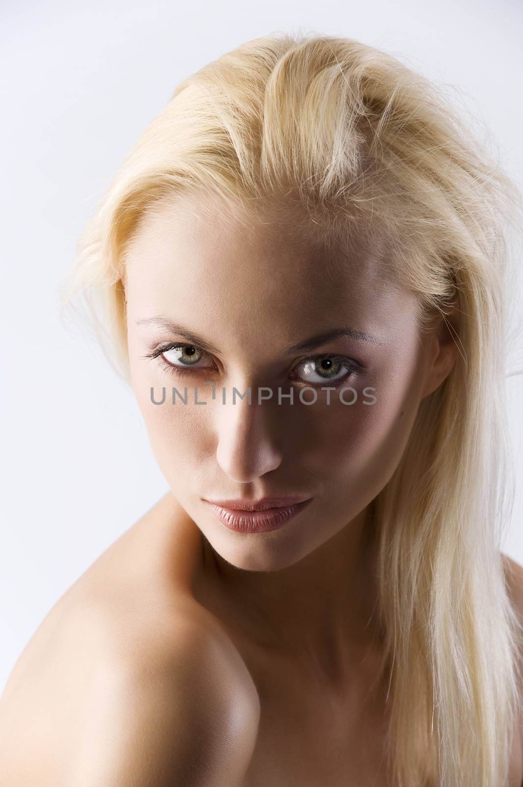 Closeup portrait of naked shoulder blond woman isolated on white background