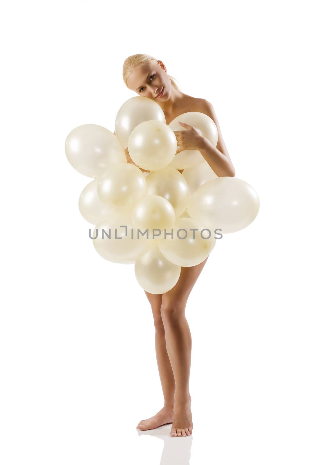 beautiful blond woman in white background covering her nude body with white balloons