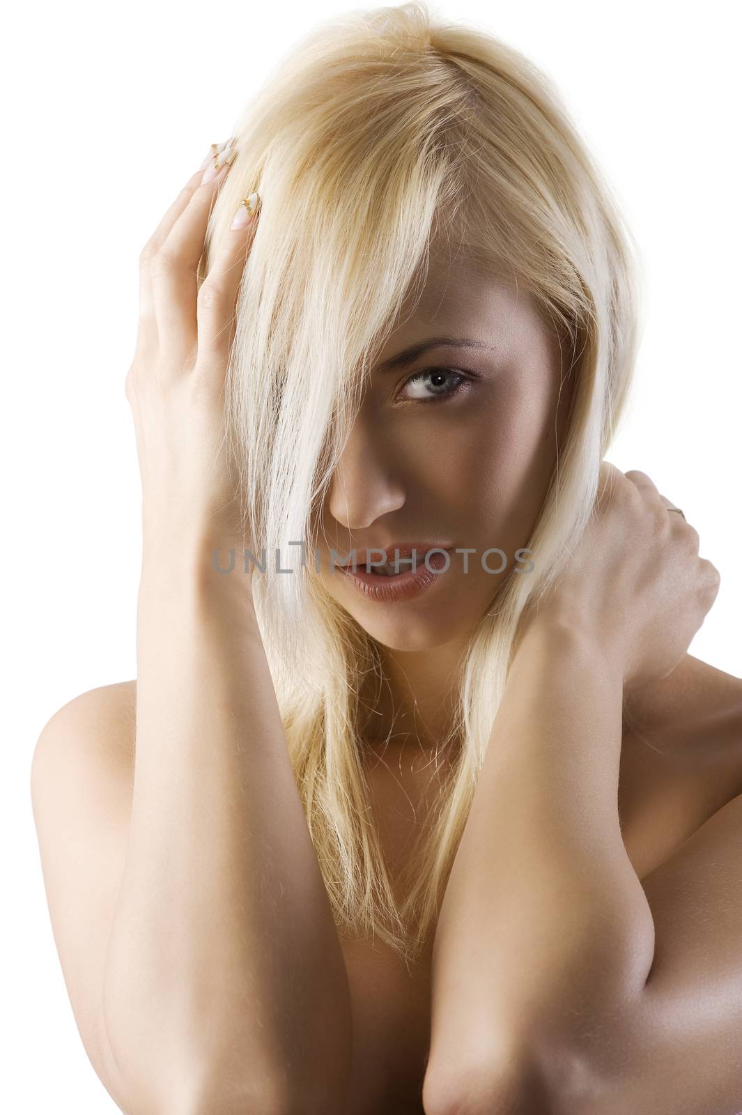 Closeup portrait of naked shoulder blond woman looking in camera with a glance