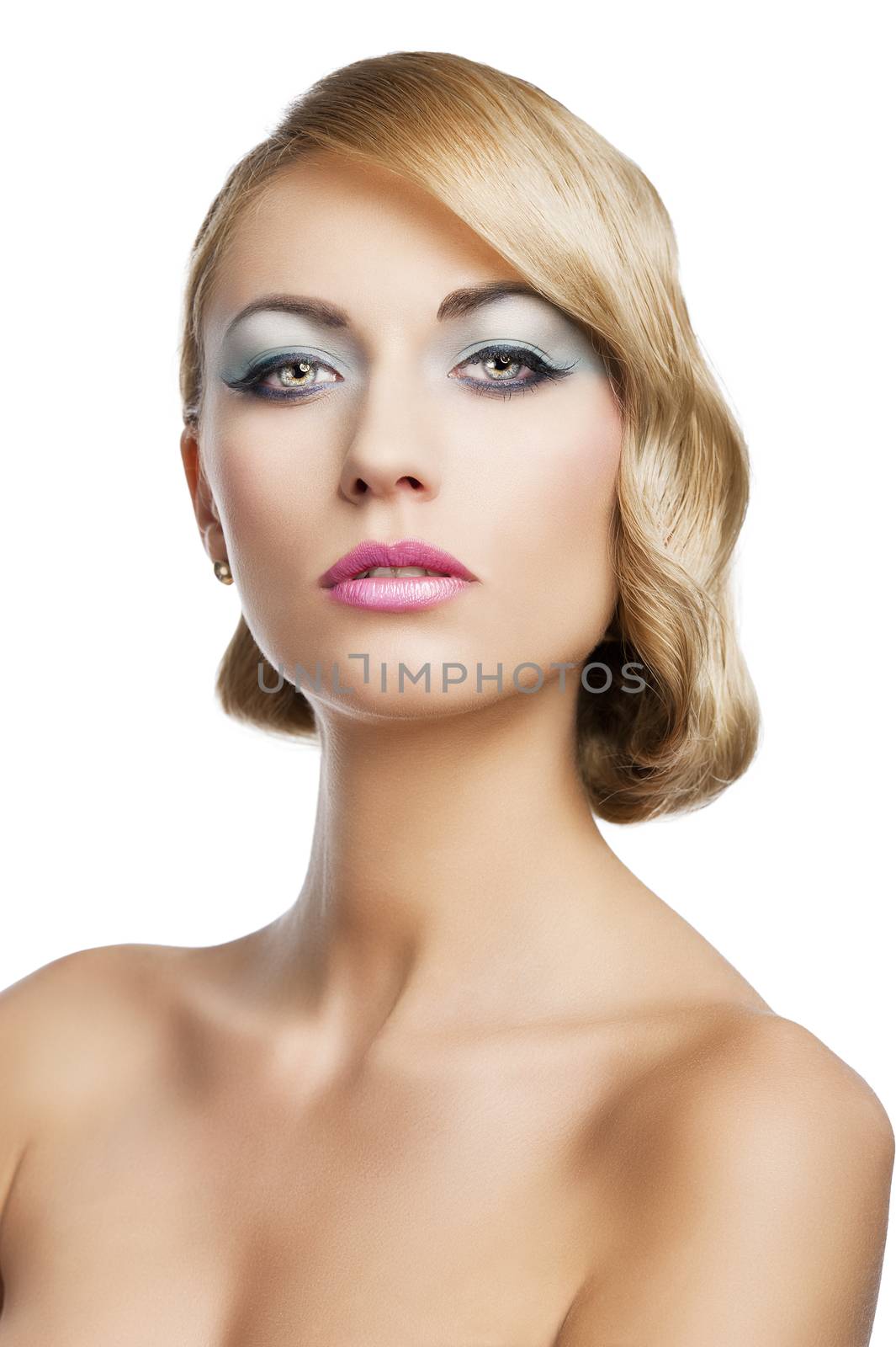 blond beautiful woman with strong make up and an old fashion hair stylish in beauty portrait close up. She is in front of the camera and looks in to the lens with mouth slightly open.