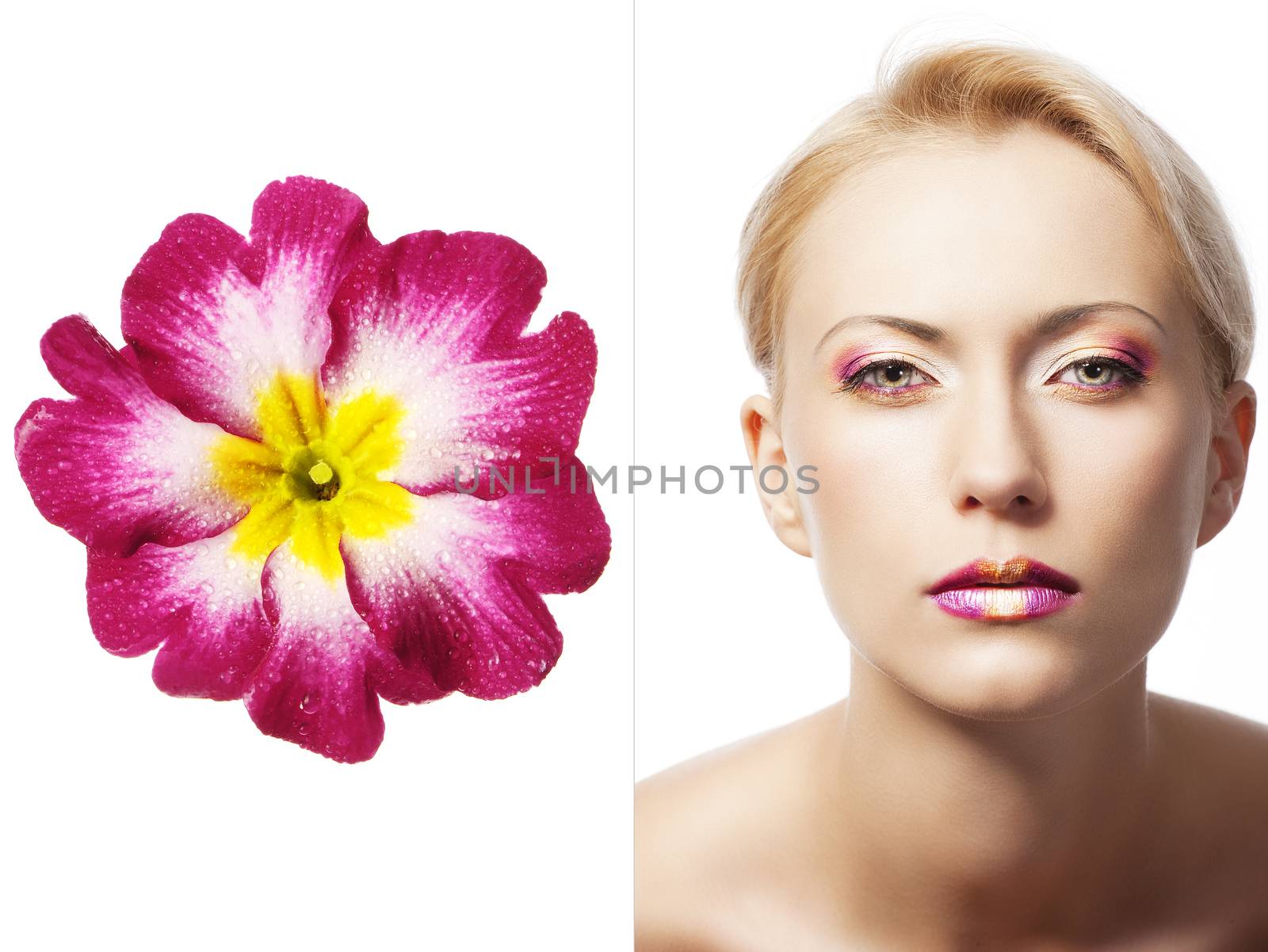 beauty young girl with a floral makeup. She is turned of three quarters and looks in to the lens with attractive expression