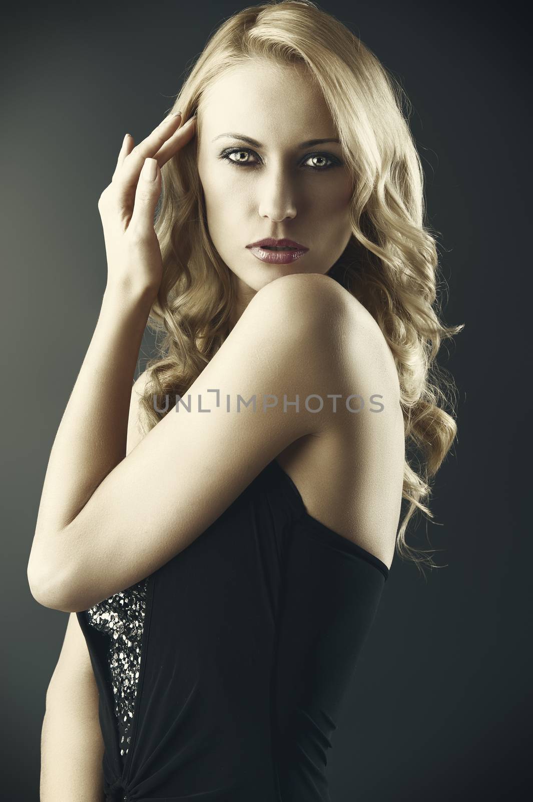 sexy blond woman with hand near the hair by fotoCD