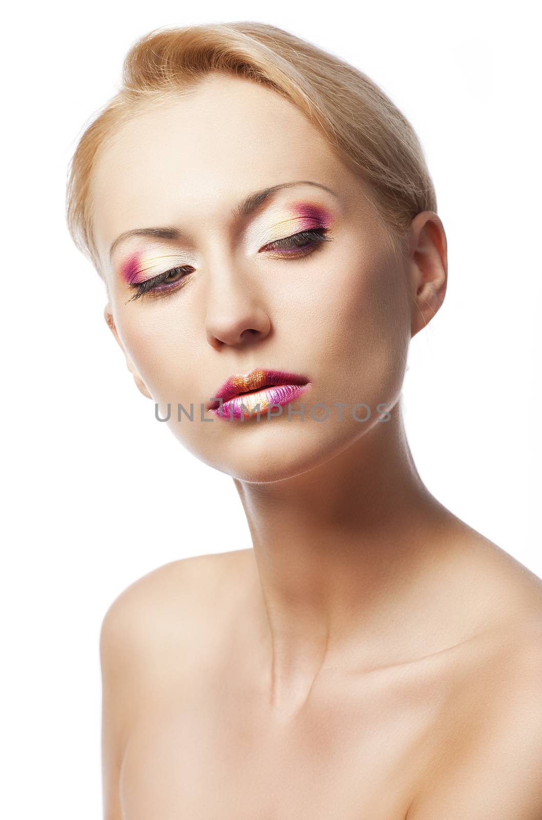 beauty young girl with a floral makeup. She is turned of three quarters and looks in to the lens with attractive expression