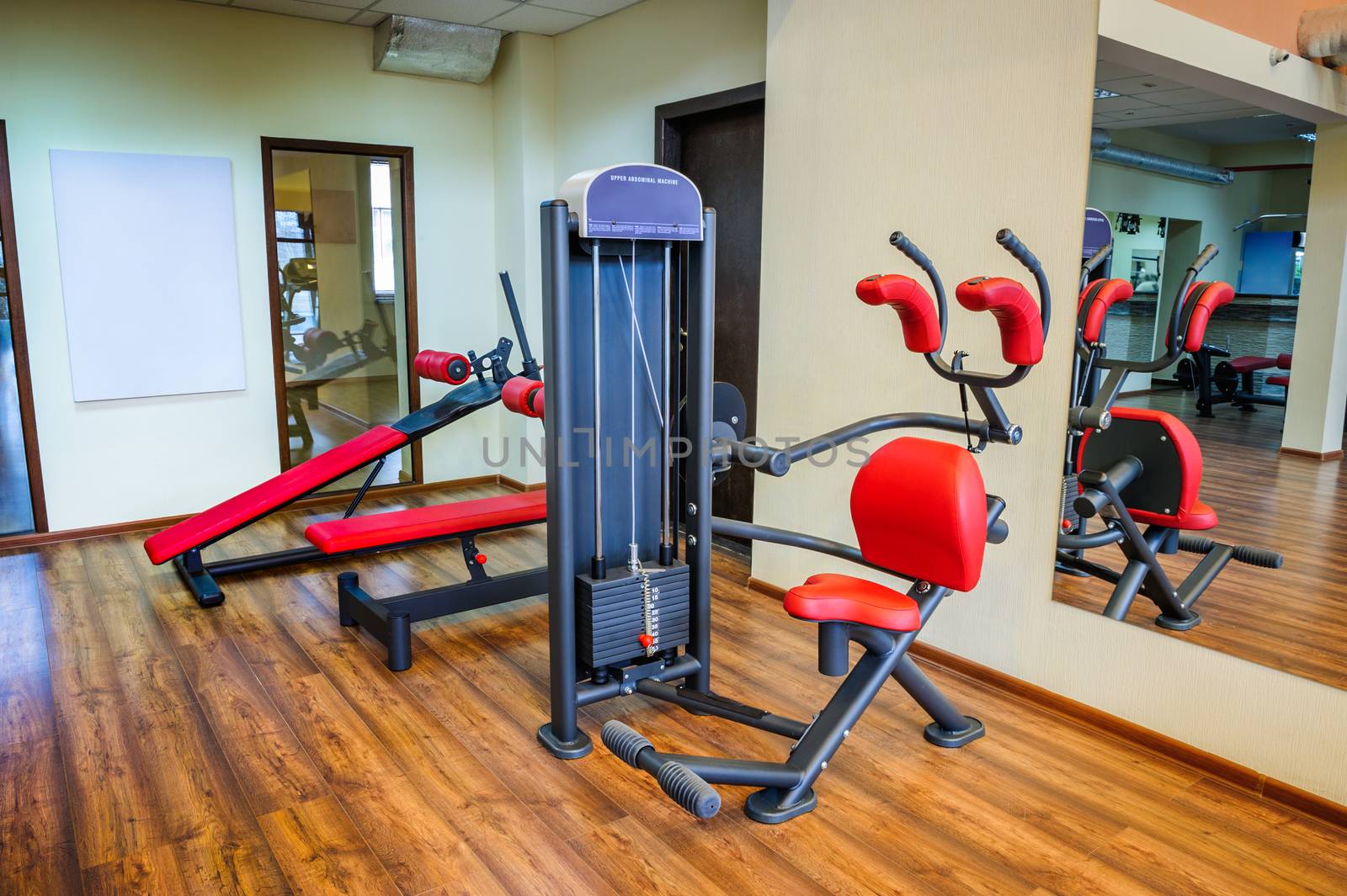 abs machine and other equipment in gym interior