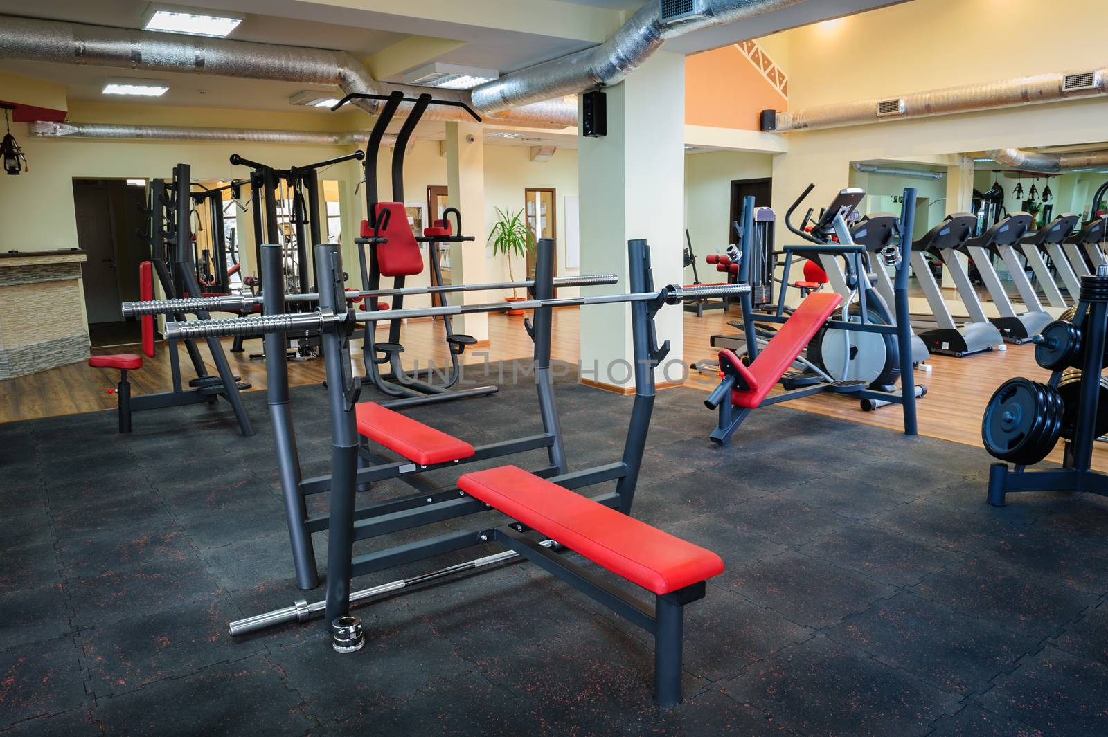 different gym machines and  equipment in gym interior